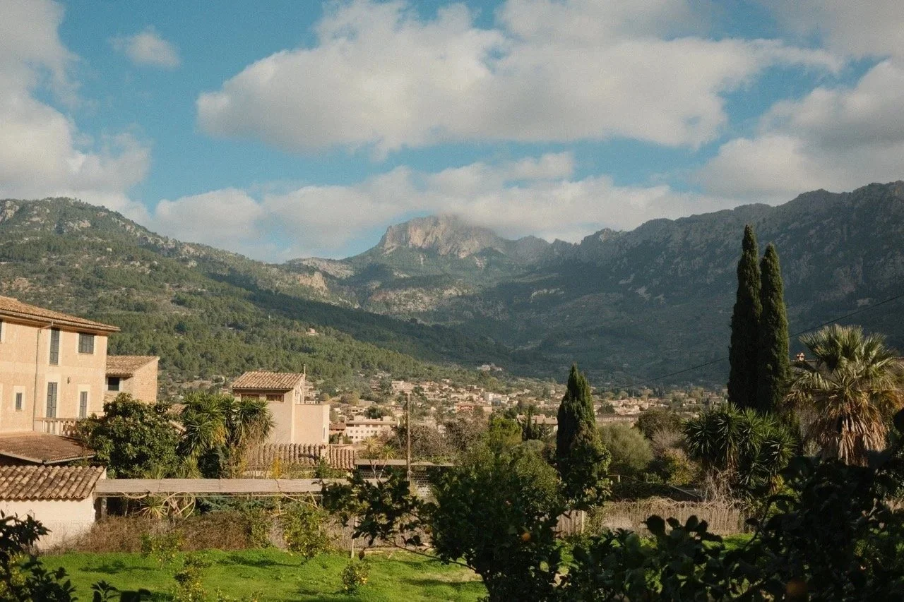 Mountain village and cypresses in a green valley of the Serra de Tramuntana, Mallorca, Spain - fine art print by Zyan Sachs