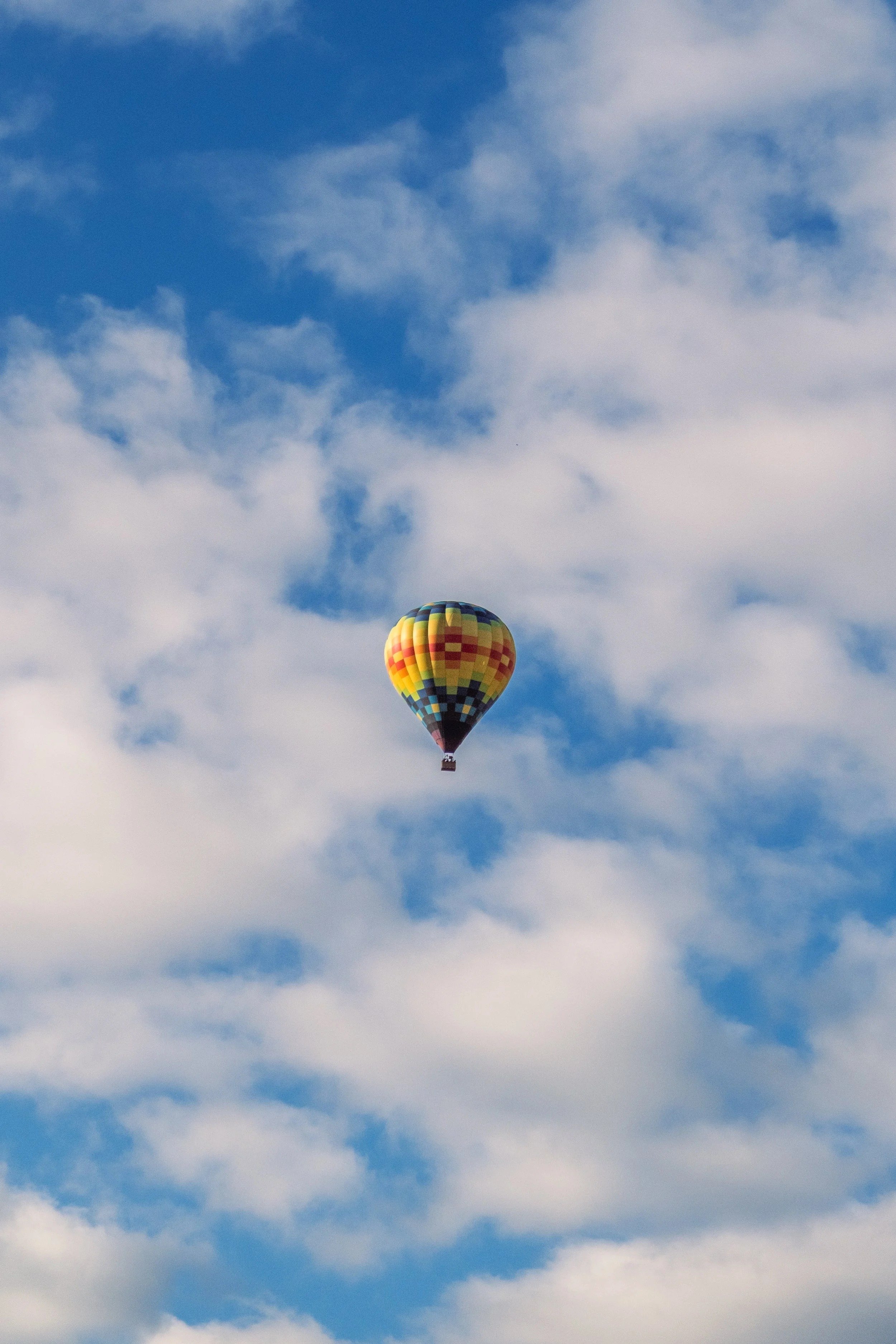Hot air balloon floating among white clouds, Temecula, California - travel photography and fine art prints by Zyan Sachs