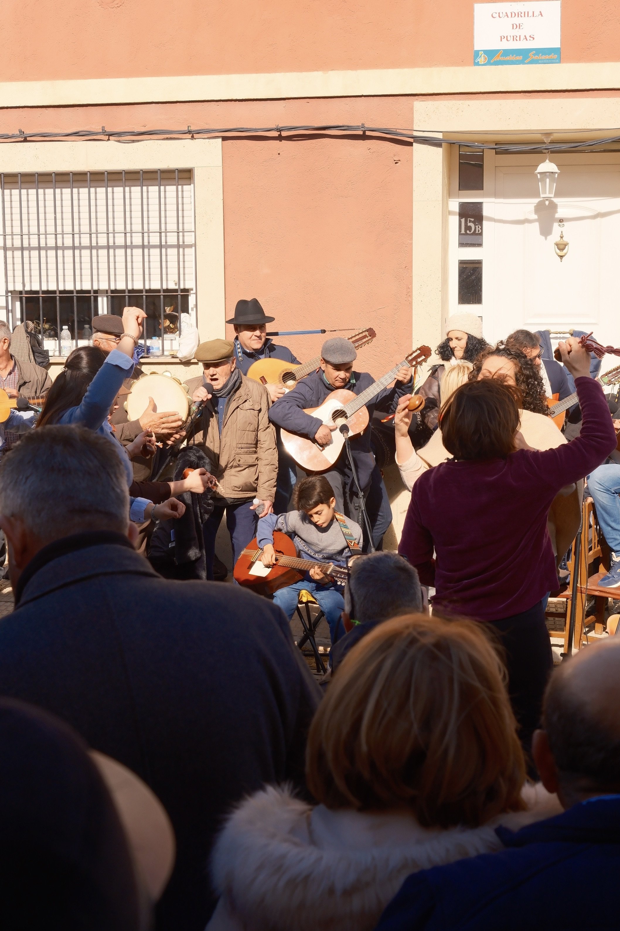 Cuadrilla folk musicians with guitars and tambourines playing in the street, Murcia, Spain, by Zyan Sachs