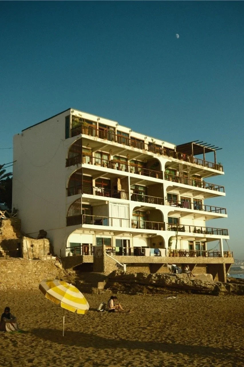 Modern balconied building on the beachfront at sunset, Taghazout, Morocco - fine art print by Zyan Sachs