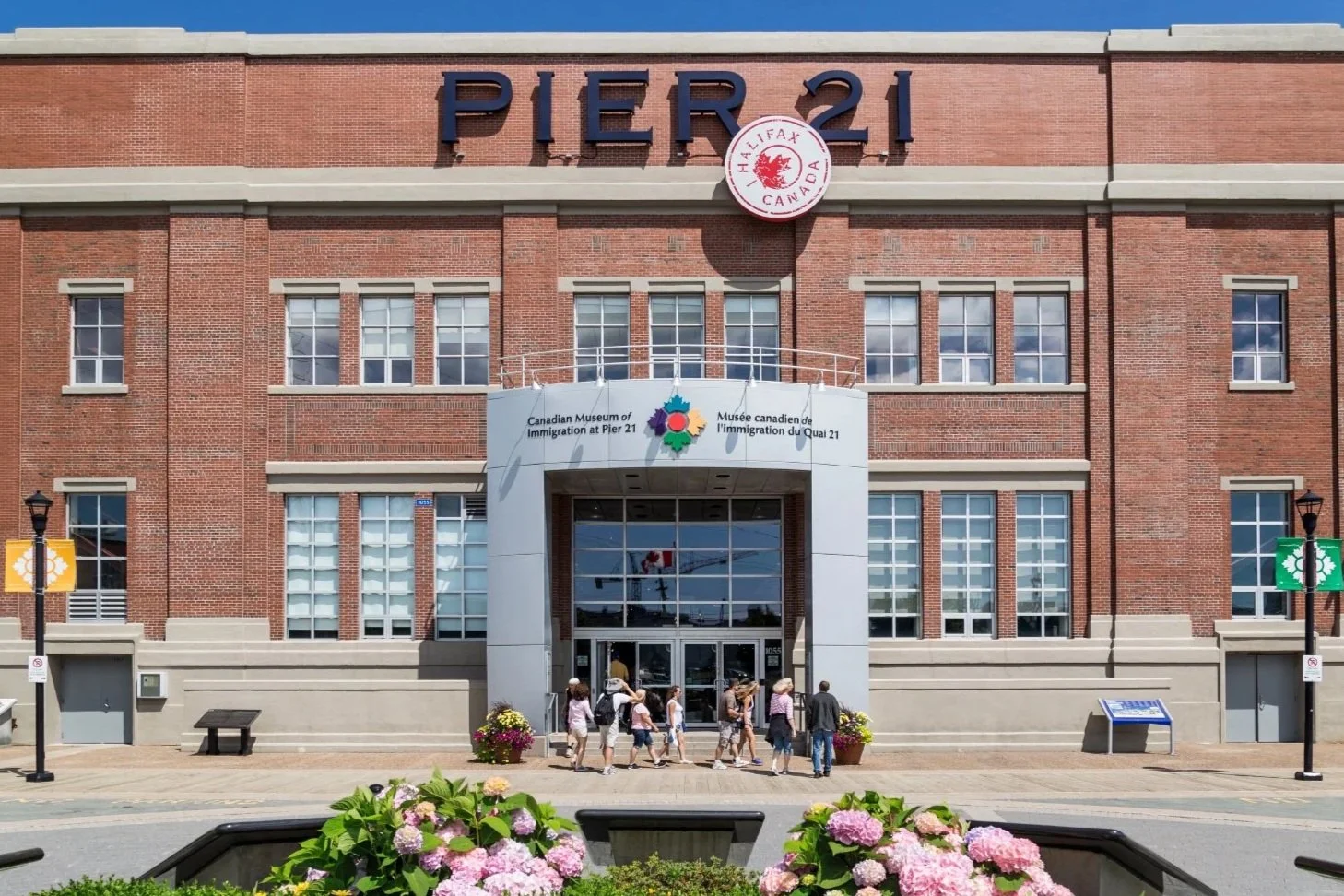 Exterior image of a large brick building with signage that says Pier 21