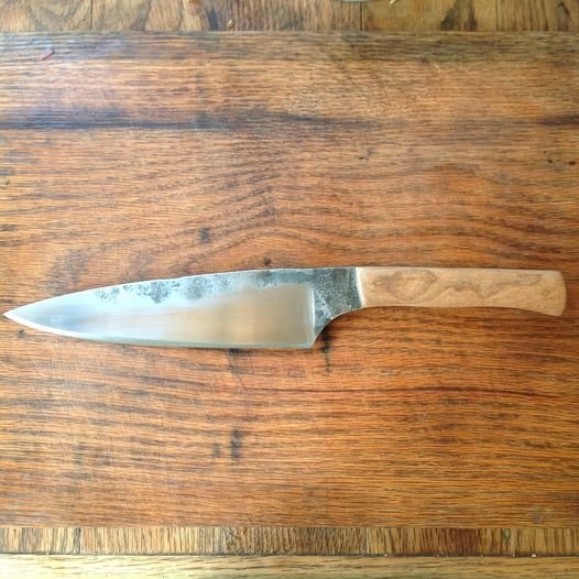 Just finished this commissioned chef's knife. Forged Hitachi 1084 steel with a cherry wood handle with brass and mosaic pins..jpg