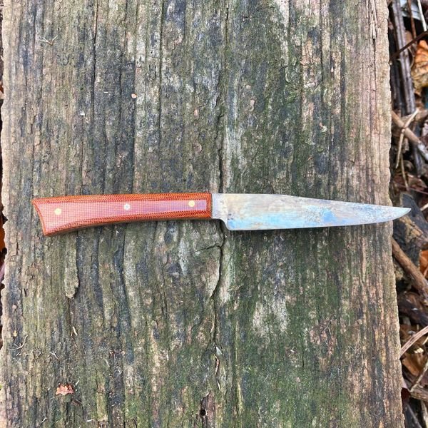 Nice pairing knife. 8670 forged steel with a mustard finish. The mustard helps inhibit rust and looks cool. Handle is canvas micarta. Photo 2.jpg