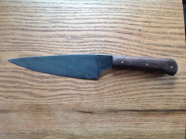 Just delivered this custom order, based on my Classic Chef's Knife design, with a black walnut handle, slightly heavier blade and hammer marks preserved on the ricasso..jpg