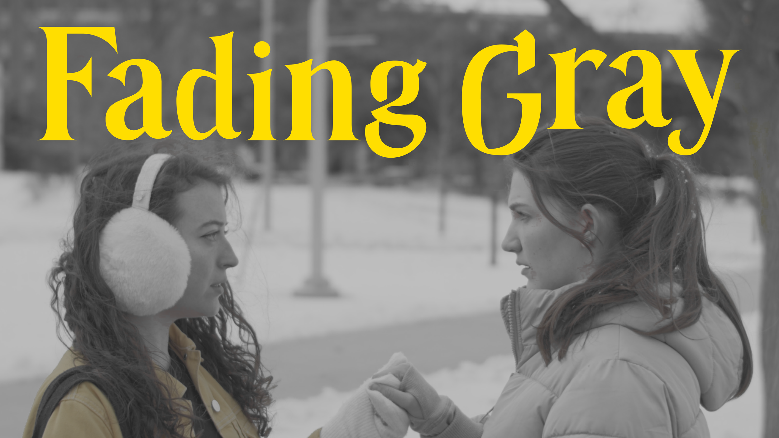 Two young women face to face outdoors in winter, one with curly hair and headphones, the other with straight hair and a puffer jacket, with the text "Fading Gray" in large yellow letters across the top.
