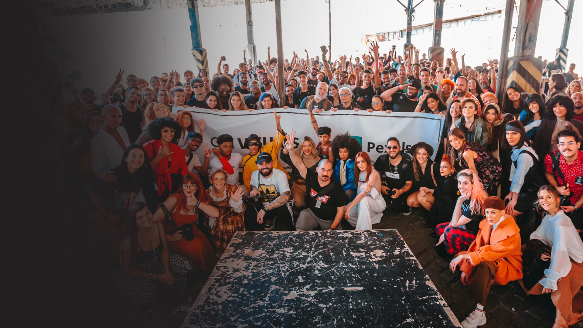 Large group of dozens of volunteers posing for a group photo during a volunteer event