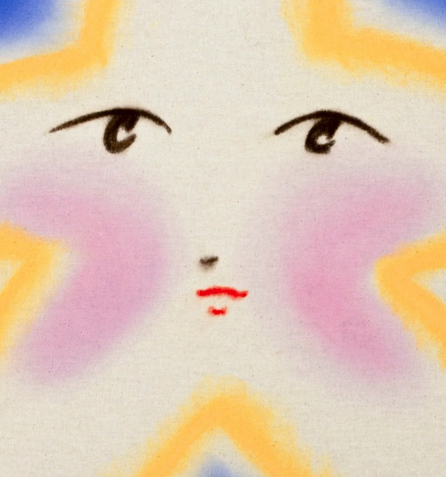 Close-up of a painting of a cartoonish face on a star.