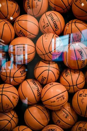 Orange basketballs displayed behind glass for Windy City Sports Cards basketball inventory.
