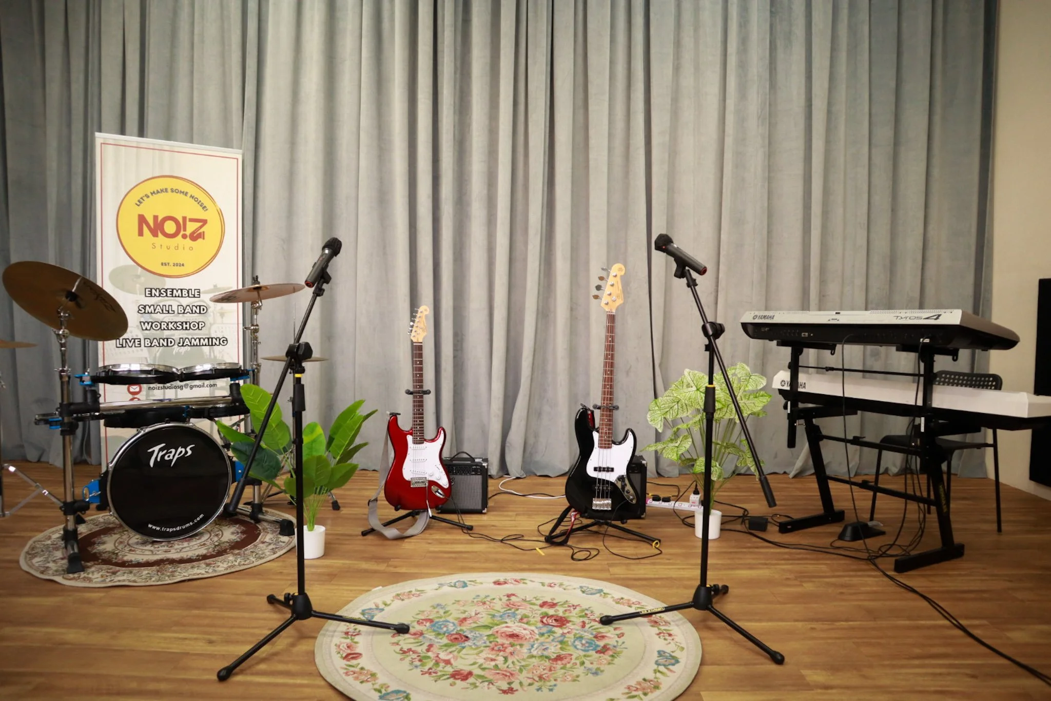 live band jamming with drumset, electric guitar, bass guitar, keyboard, digital piano and 2 wireless microphones