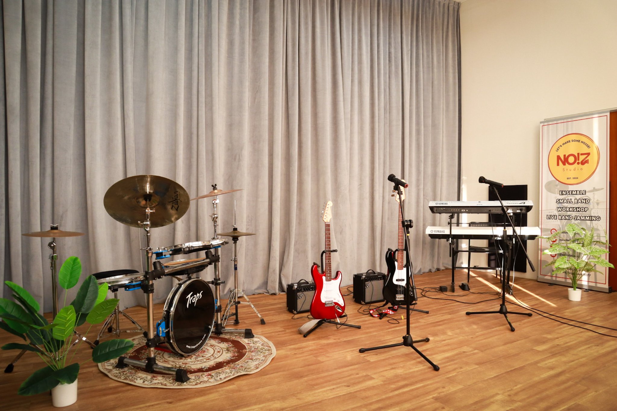 live band jamming with drumset, electric guitar, bass guitar, keyboard, digital piano and 2 wireless microphones