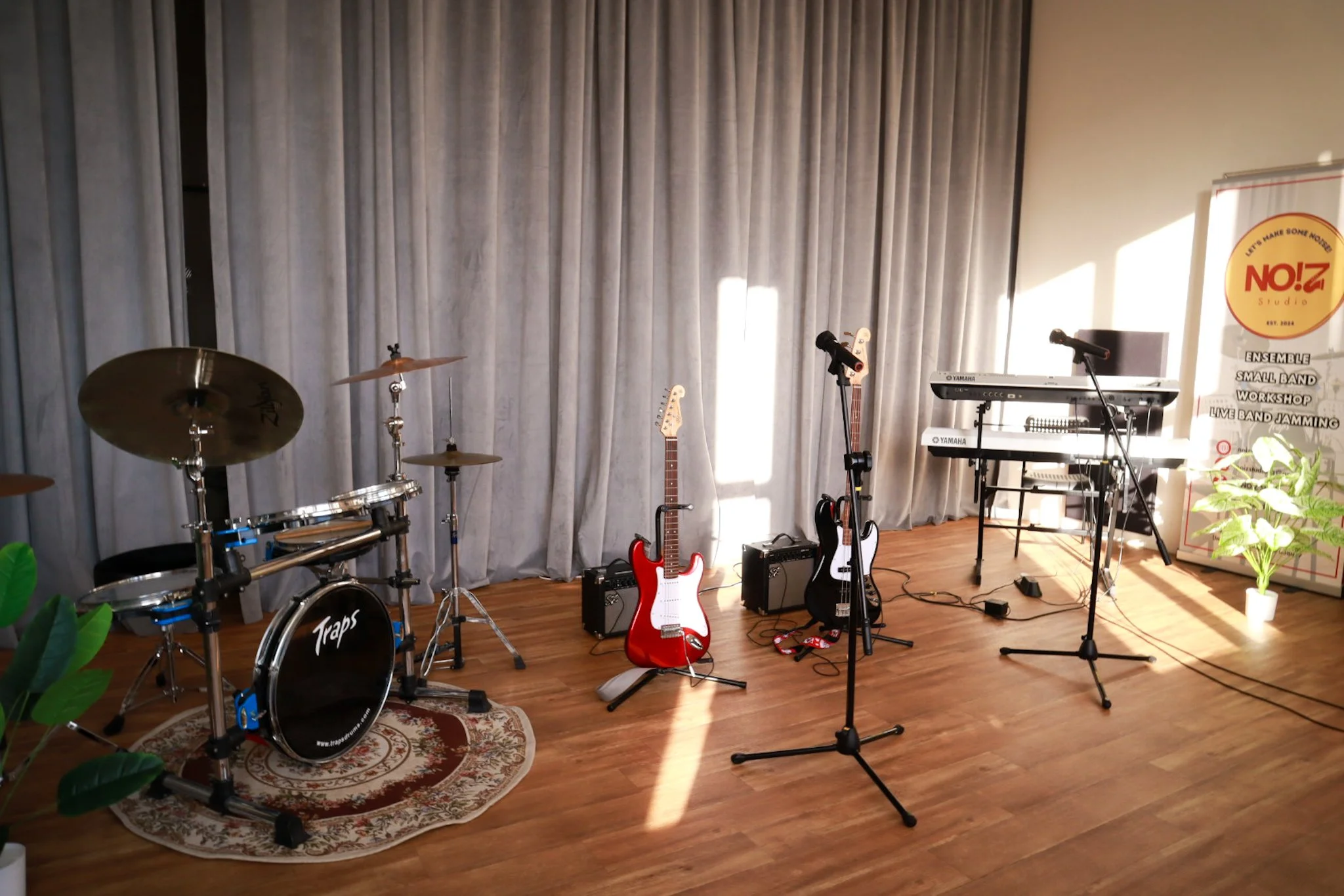 live band jamming with drumset, electric guitar, bass guitar, keyboard, digital piano and 2 wireless microphones