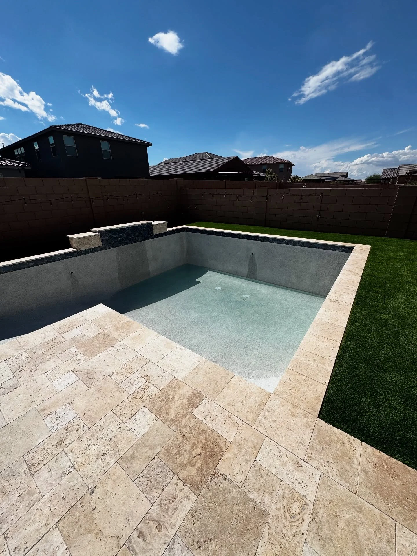 Water&rsquo;s flowing and the vision&rsquo;s coming to life 💧 Custom water feature, travertine decking, and a smooth mini pebble finish. All done in just 52 days from dig to fill! Not quite finished yet&hellip; pergola installation coming soon to co
