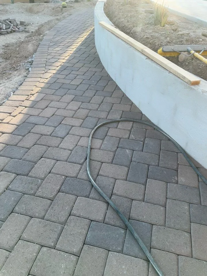 A halfway update on this project! Getting these pavers completed and forming that CUSTOM wood burning chimney 🤩🤩 Designed by @denomy_designs bringing this to life! Using those curves and pavers colors to embrace that desert aesthetic 🌵🏜️ 
#tucson