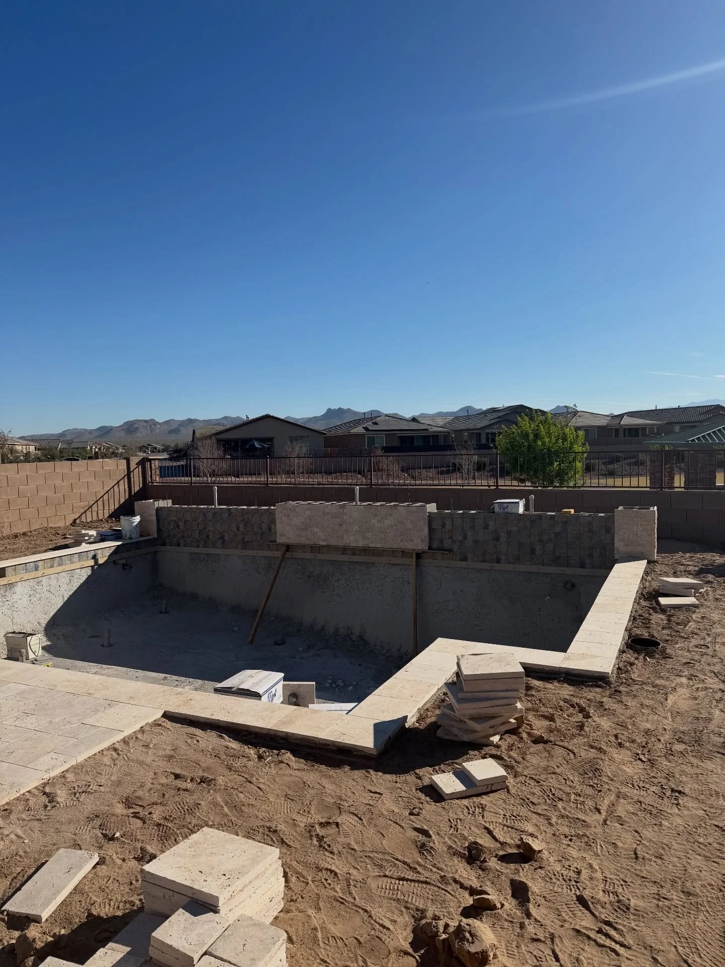 This wide, side-to-side water feature is going to be a showstopper featuring 3 water curtains and 2 fire bowls for the perfect balance of movement and flame. Wrapped in a mix of stone veneer and tile for that bold contrast and high-end finish.

Upgra