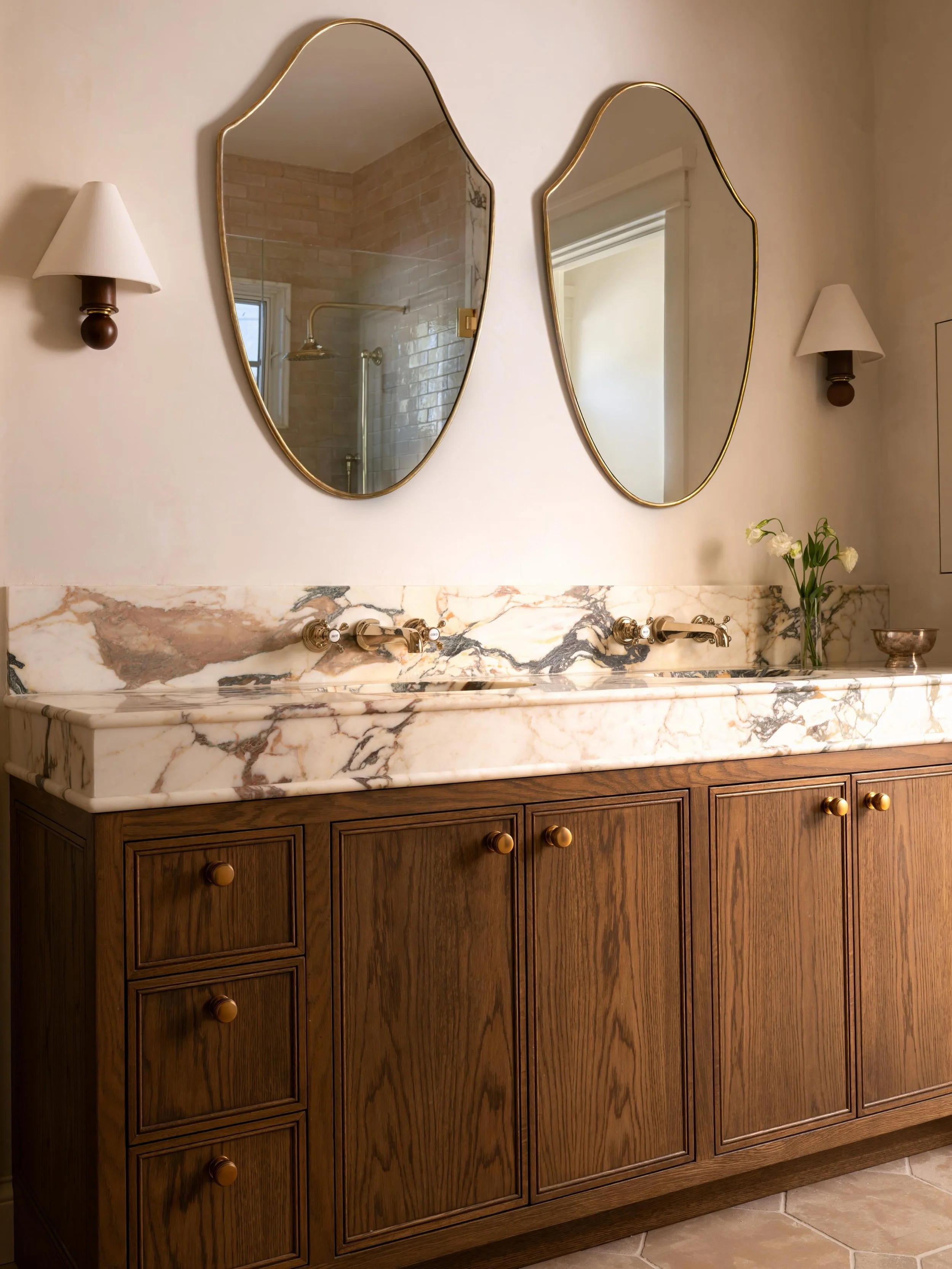 DOUBLE TROUBLE two vanities in one space? yup, we can do that. sometimes one ain&rsquo;t enough. if you can do a separate get ready vanity DO IT. we cancelled the tub &amp; moved the shower, which opened up lotsssss of space. things we love? the rich