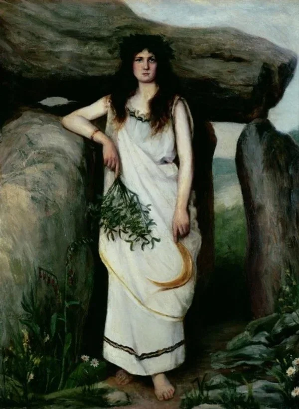 Painting of a woman with long dark hair, wearing a white dress, standing in front of a large stone structure with greenery and flowers at her feet.