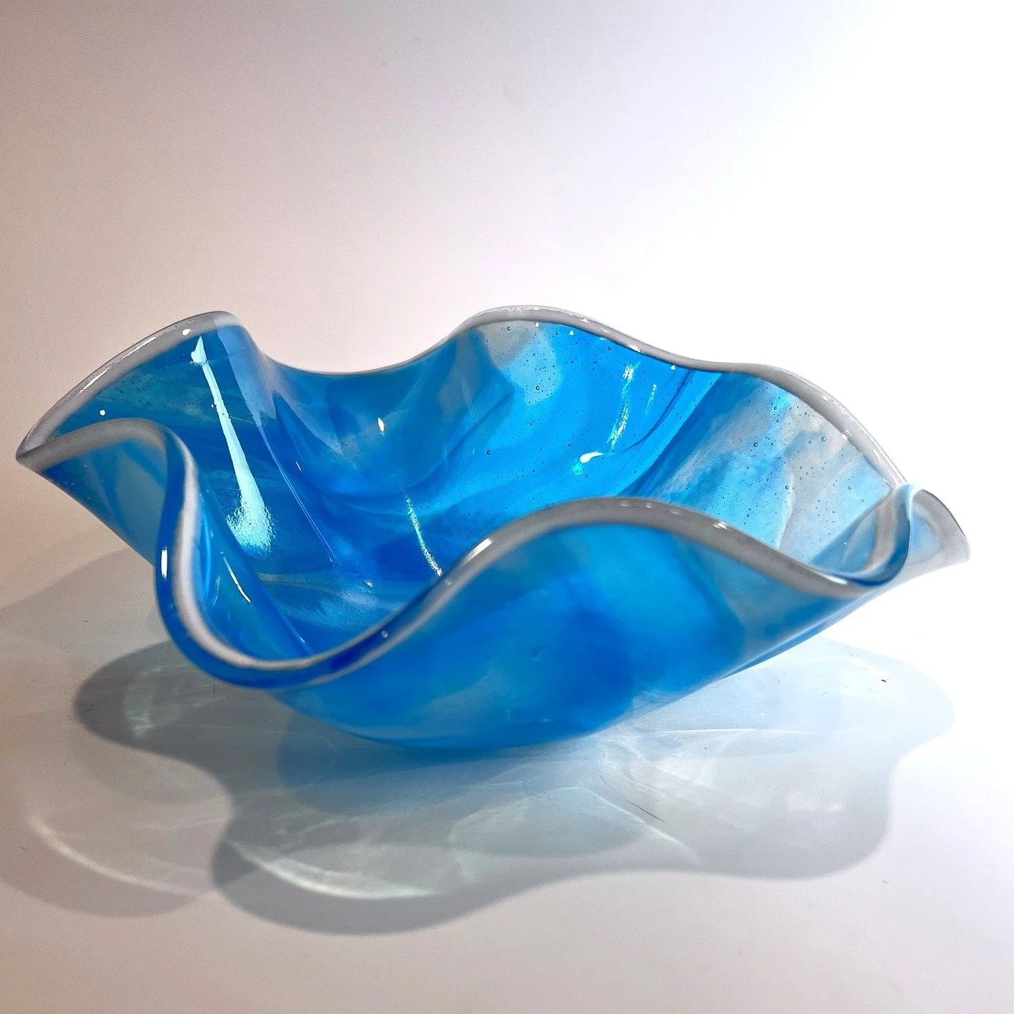 Artist: Suzanne Arden Flow Bowl&rdquo; is a fused glass piece created by firing concentric circles of streaky glass together and then firing a second time, slumped into a mold, to give it this undulating shape. #visitoccoquan, #fusedglass, #glassart,