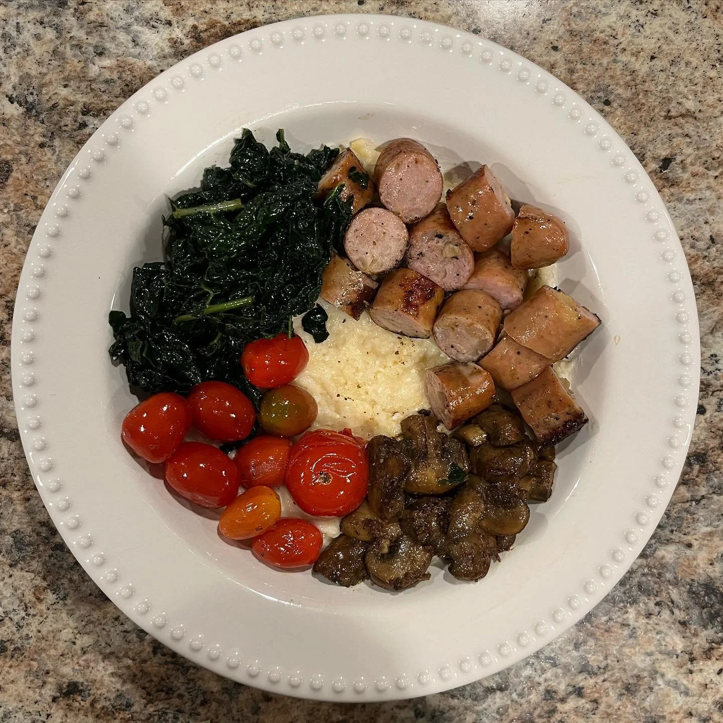 Trying out some fun new bowls: Grits Bowl with chicken sausage, tomatoes, kale, and mushrooms!