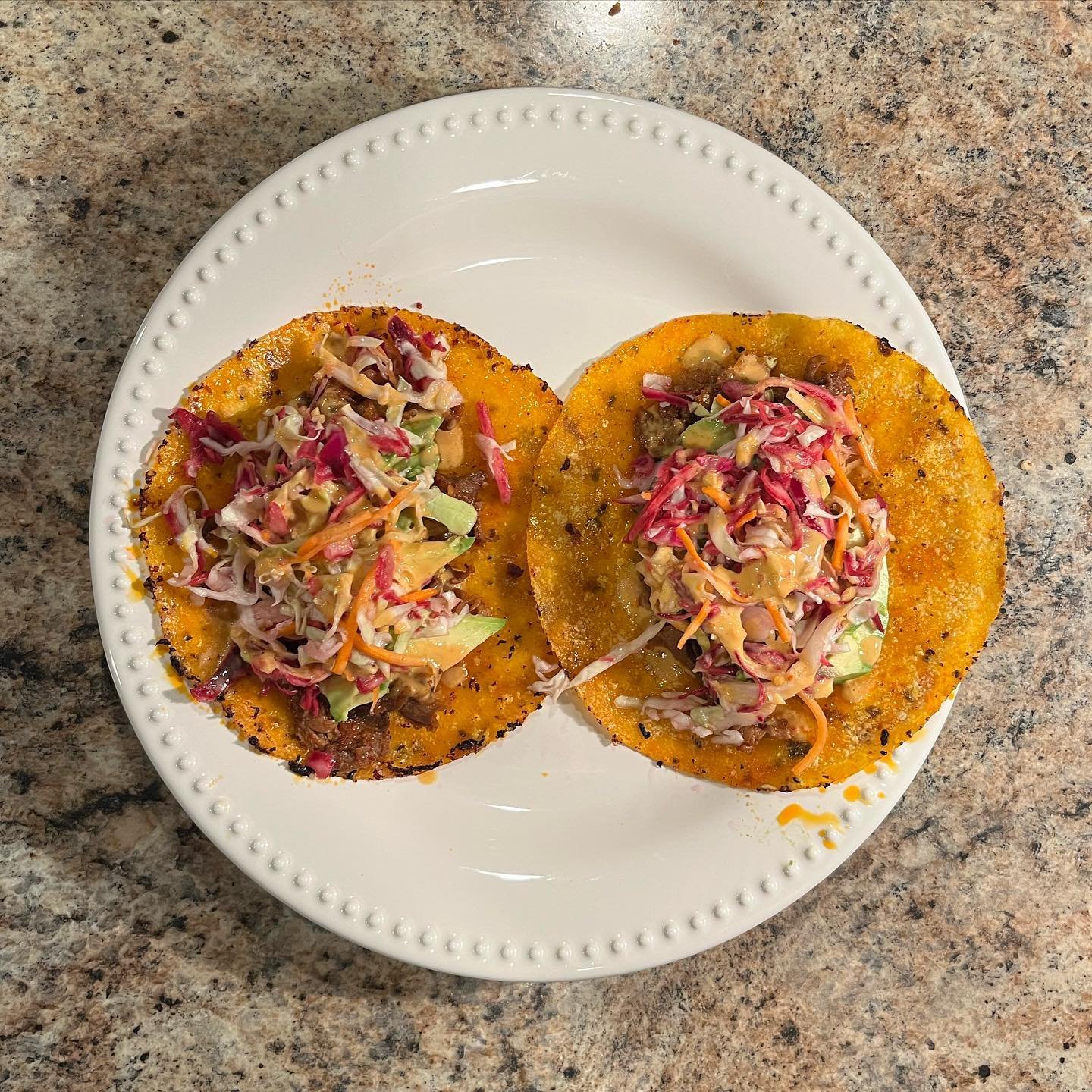 Pork bulgogi tacos with pickled cabbage and kimchi