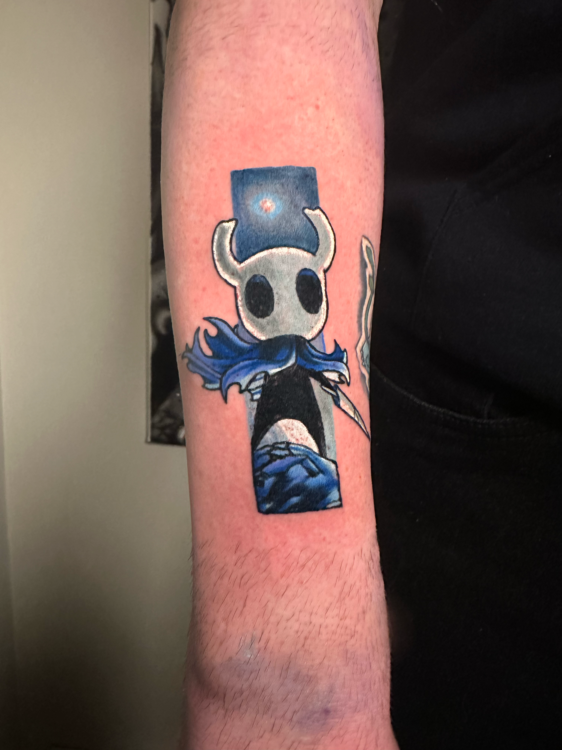 Hollow Knight tattoo on forearm