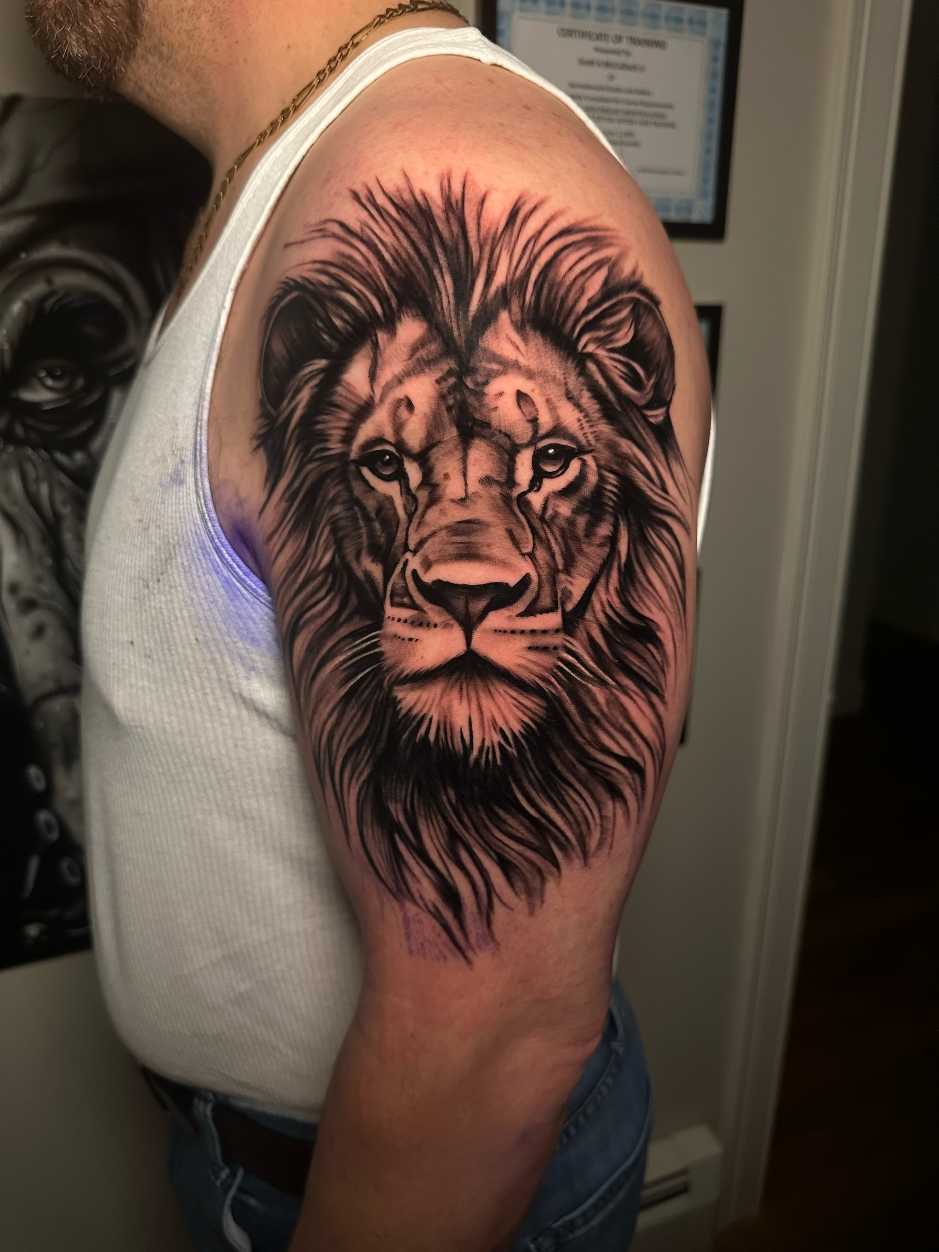Lion tattoo on shoulder