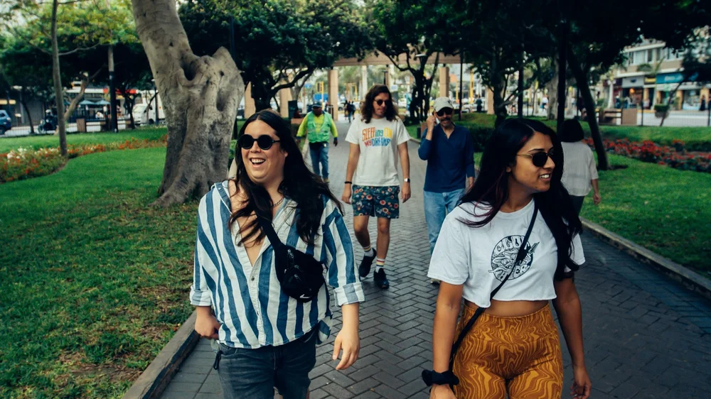 Travelers walking through Lima