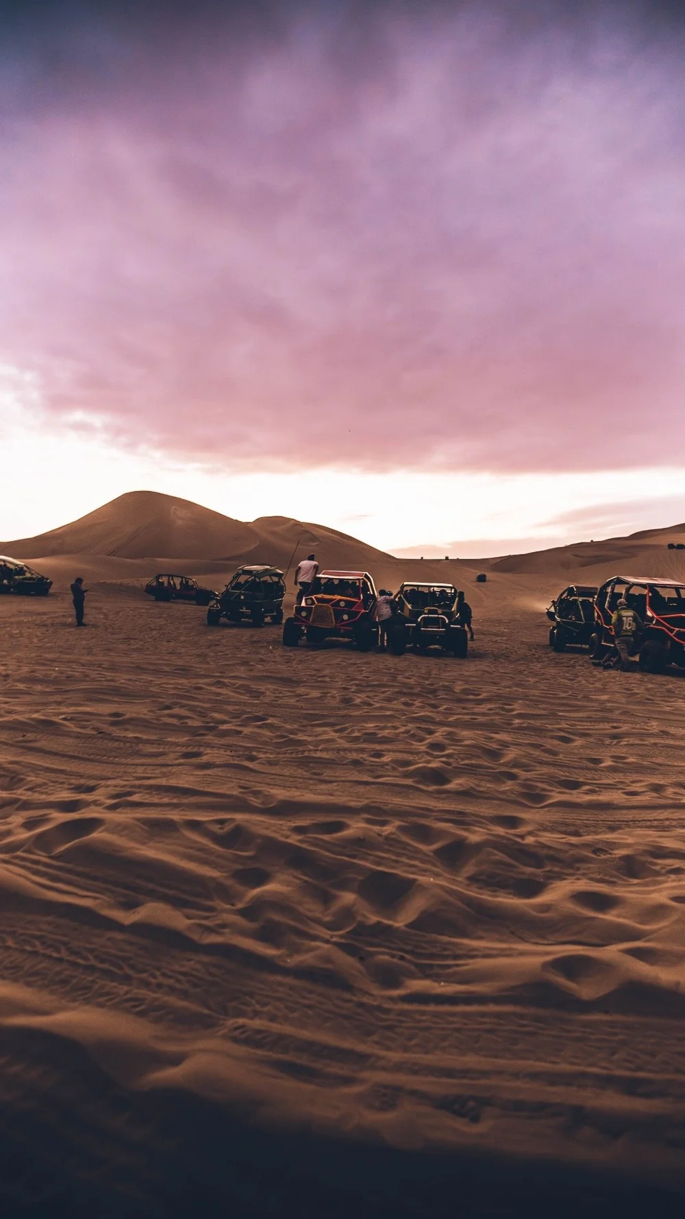 Dune buggies at sunset in Huacachina