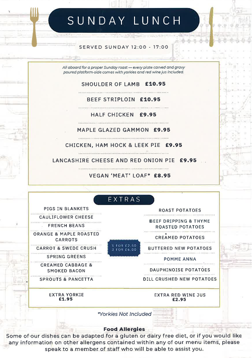 Sunday lunch menu served from 12 to 5 pm, with options including shoulder of lamb, beef sirloin, half chicken, maple glazed gammon, chicken, ham hock, and leek pie, Lancaster cheese and red onion pie, and vegan 'meat' loaf, along with various extras like roast potatoes, cauliflower cheese, French beans, carrots, spring greens, and puddings, priced from 8.95 to 10.95 pounds.