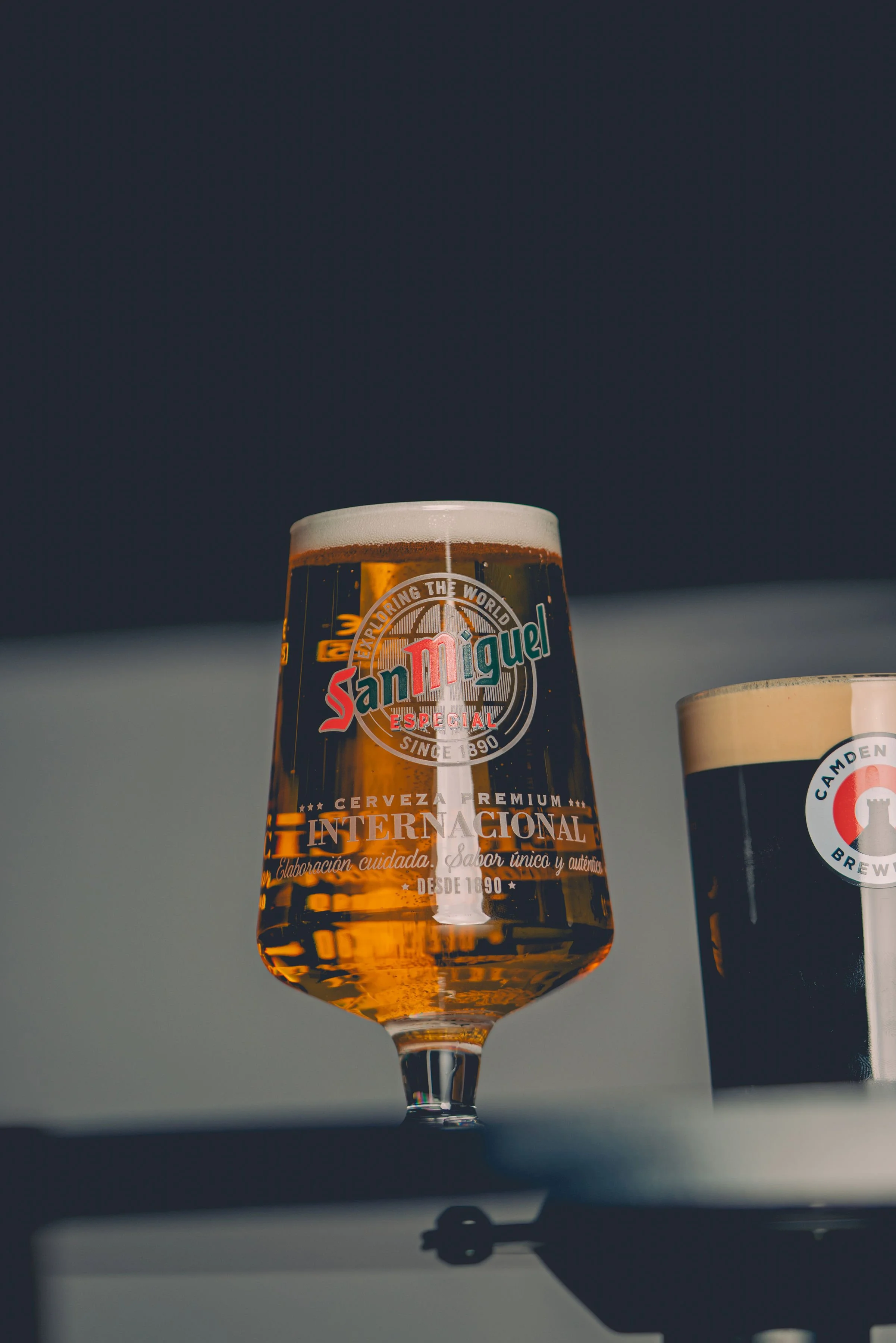 A Pint of San Miguel alongside a Pint of Camden Town Beer