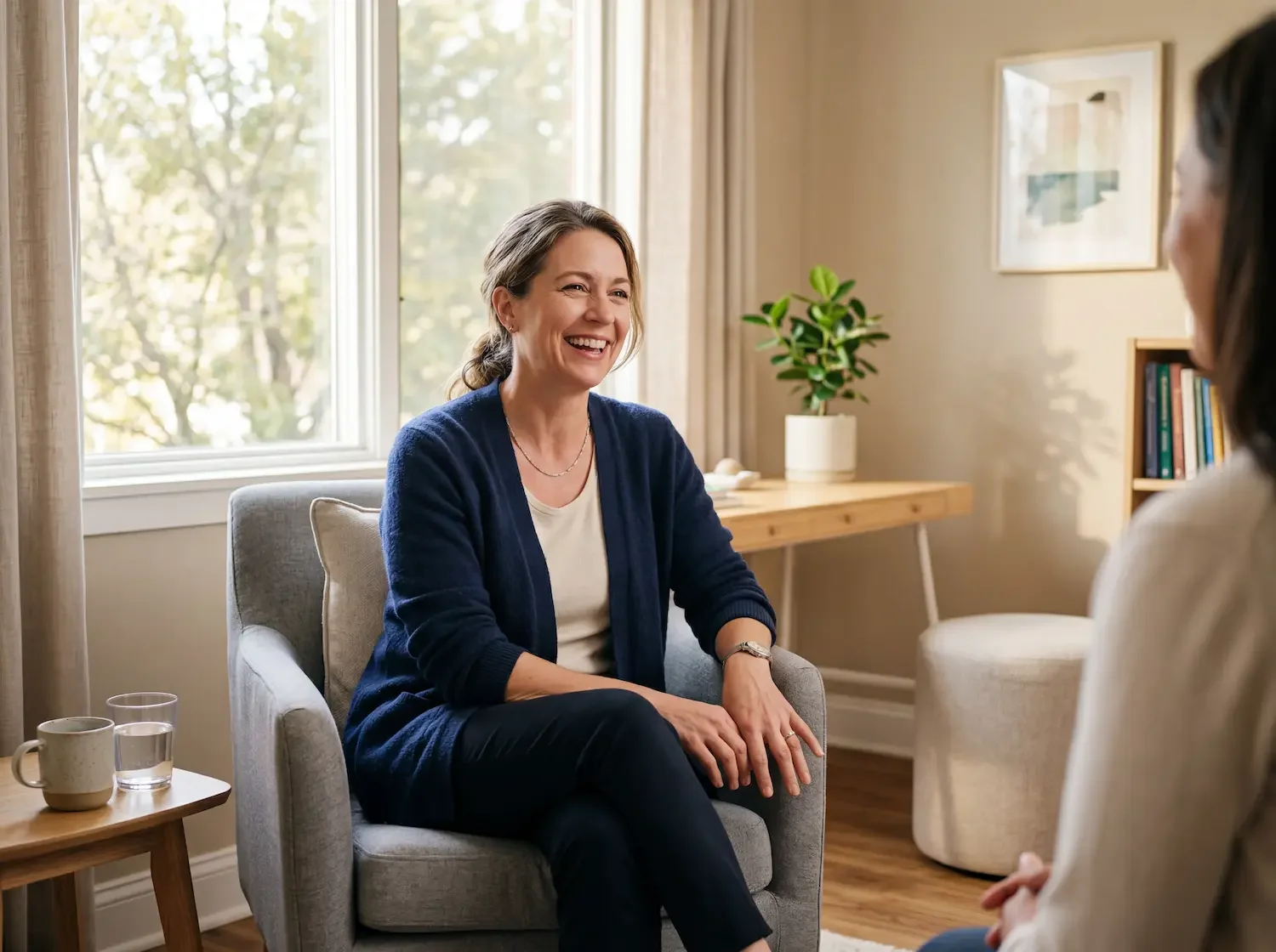 Woman in her mid-40s in a calm, unhurried exam room — concierge women's health care at Concierge Medicine of Cincinnati