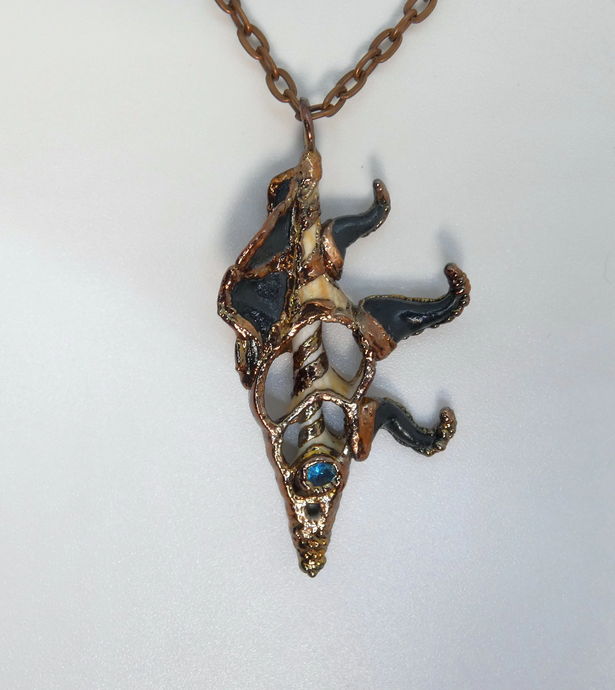 Symbiont 006 (Pendant): seashell slice, faceted aquamarine, epoxy clay, electroformed in copper. 2.5” H x 1” W. In private collection.