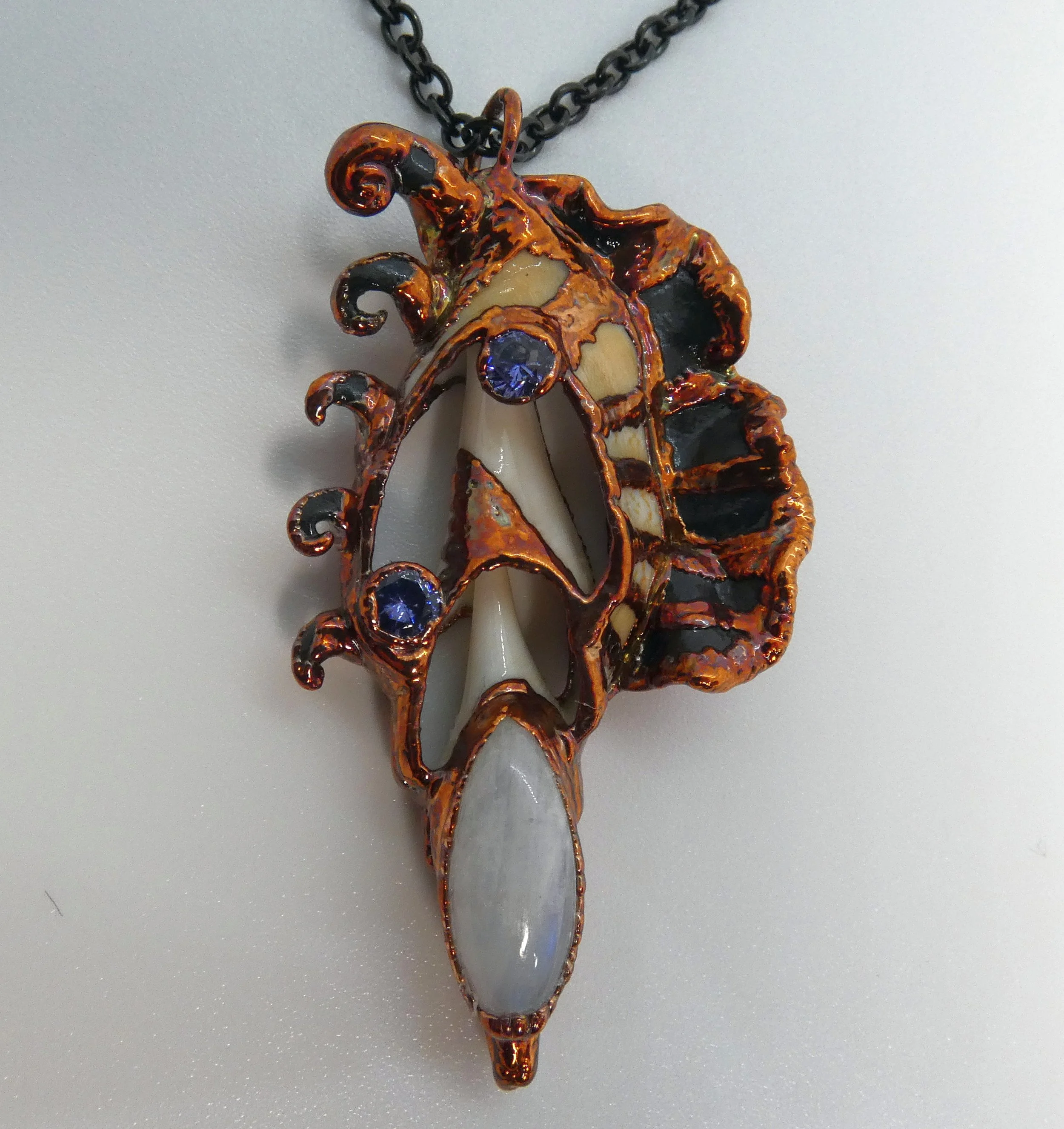 Symbiont 045 (Pendant): seashell slice, moonstone, rhinestones, epoxy clay, electroformed copper. 2.5" H x 1.5" W. Available $200.