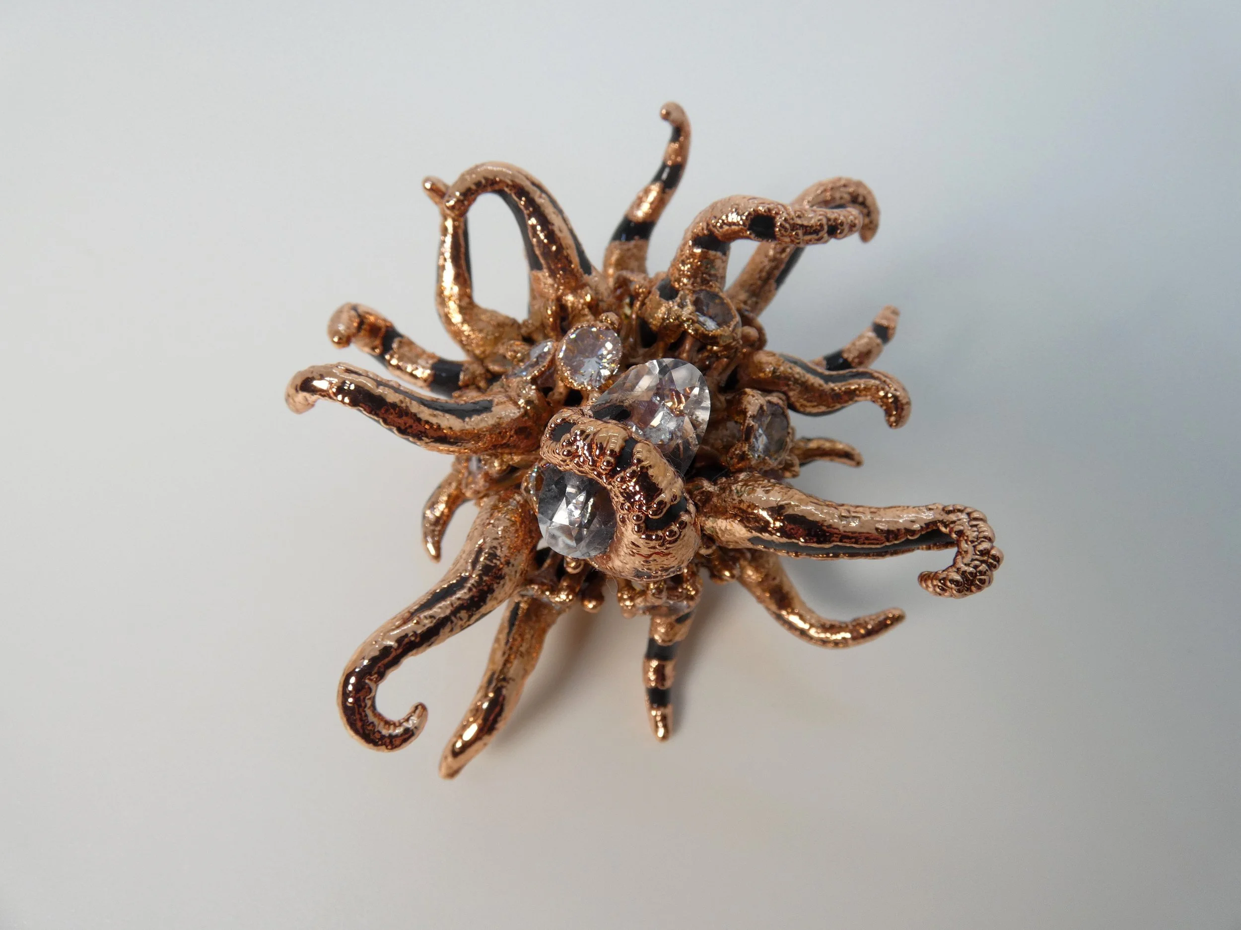 Emergence 004 (A Gift)
sycamore seed ball, faceted quartz, rhinestones, epoxy clay, electroformed copper. 2" H x 3" W x 3" D figurine. Not for sale. 
