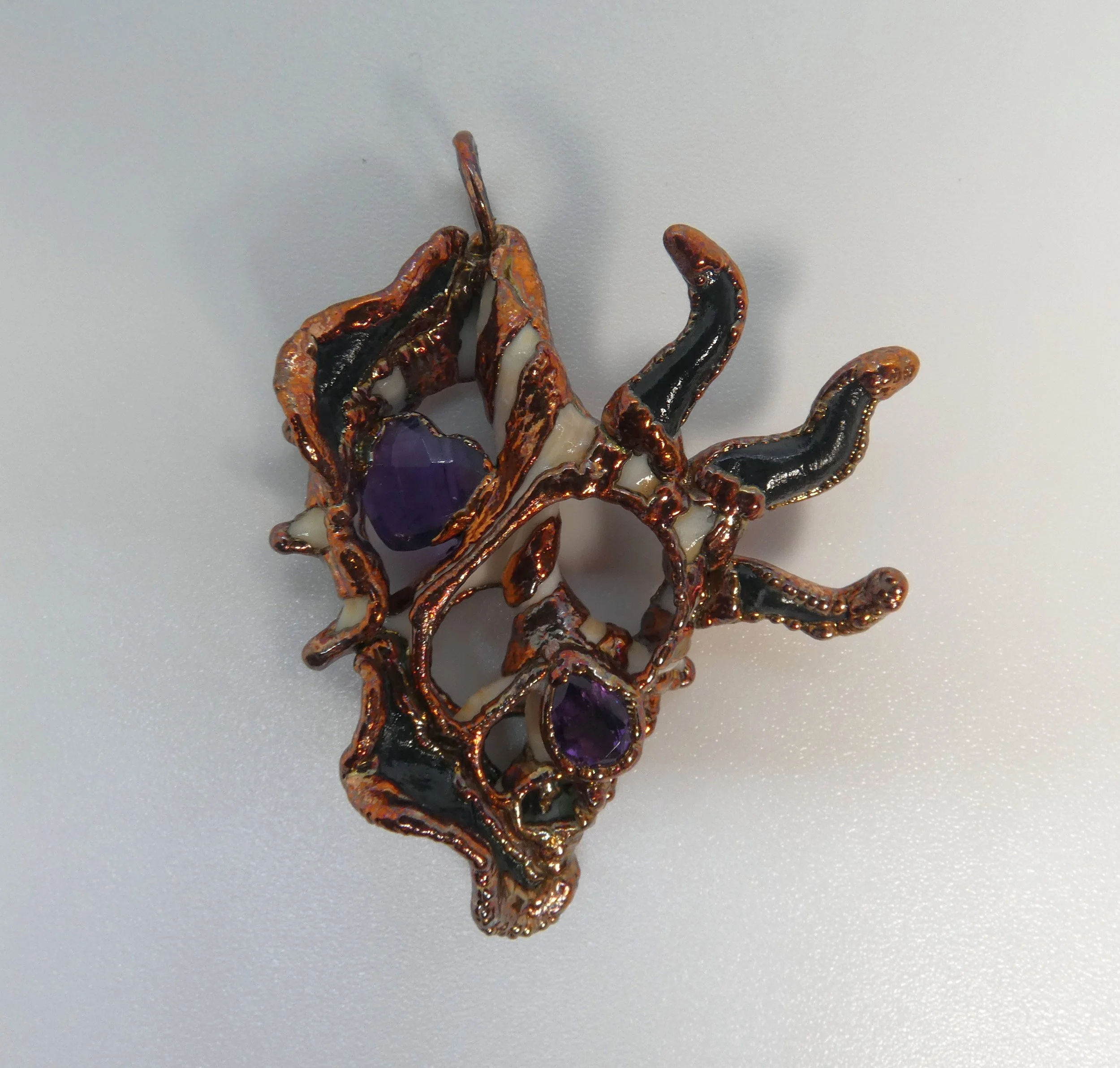 Symbiont 013 (Pendant): seashell slice, faceted amethyst, epoxy clay, electroformed in copper. 1.5”H x 1.5” W. Available $225.