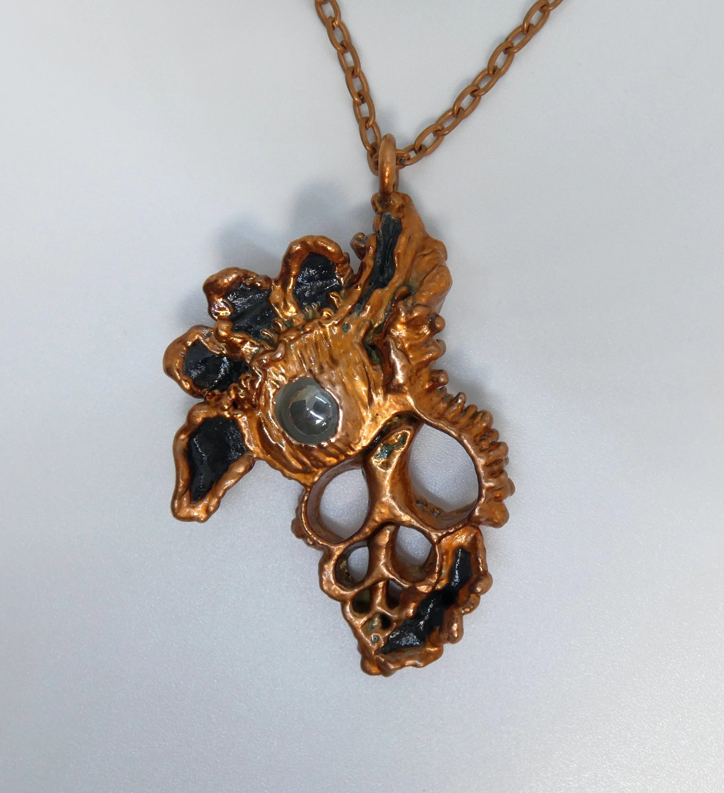 Symbiont 001  (Pendant): seashell slice, moving glass marble, epoxy clay, electroformed in copper. 3” H x 2” W.  Not for sale - in my private collection, as this first piece is not only sentimental, but has collected the fingerprints of almost every 