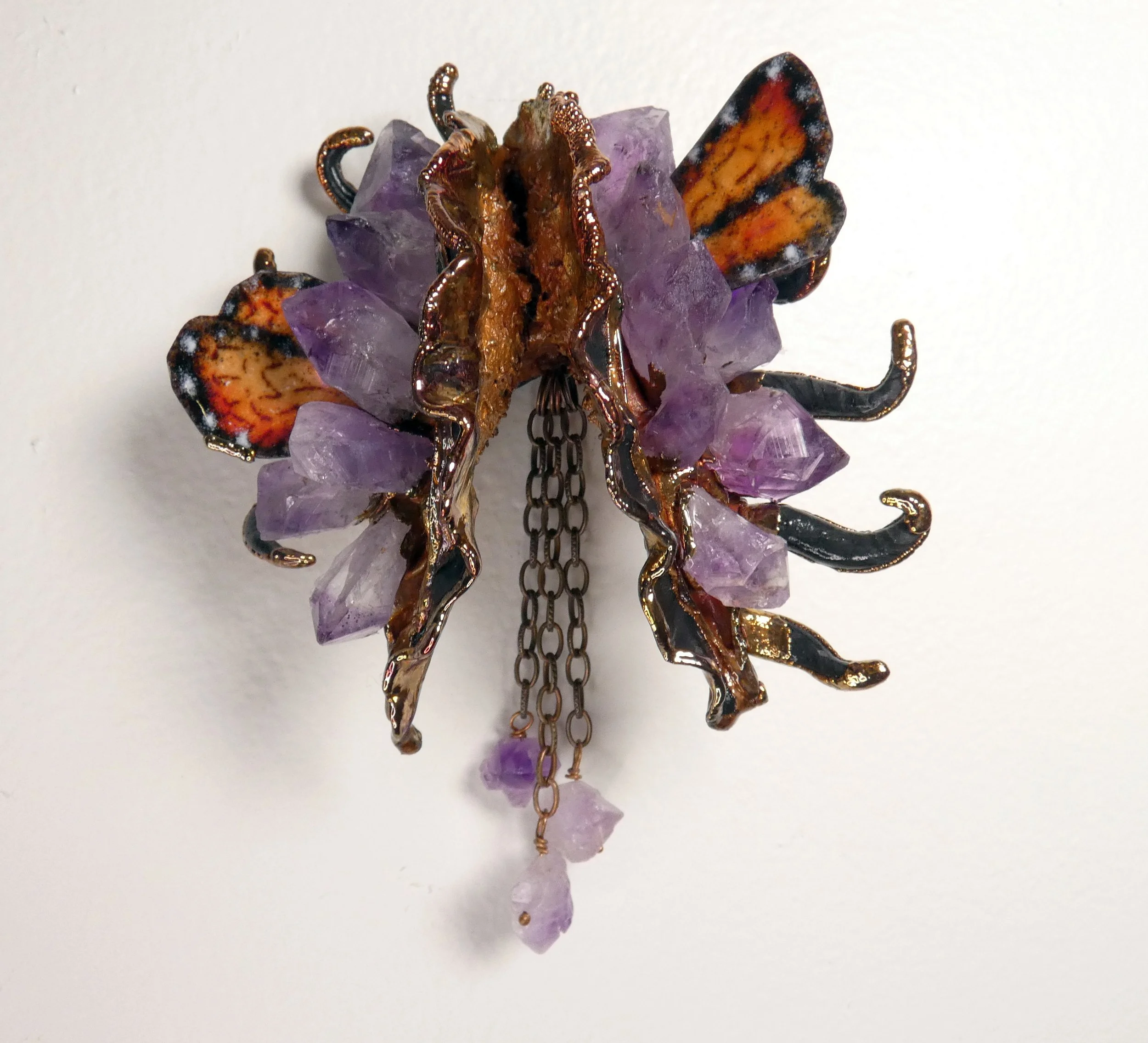 Symbiont 052 (Wall sculpture): double milkweed pod, enameled copper monarchs, amethyst points, copper chain, epoxy clay, electroformed copper. 5" H x 4.5" W x 3” D. Available $1200.