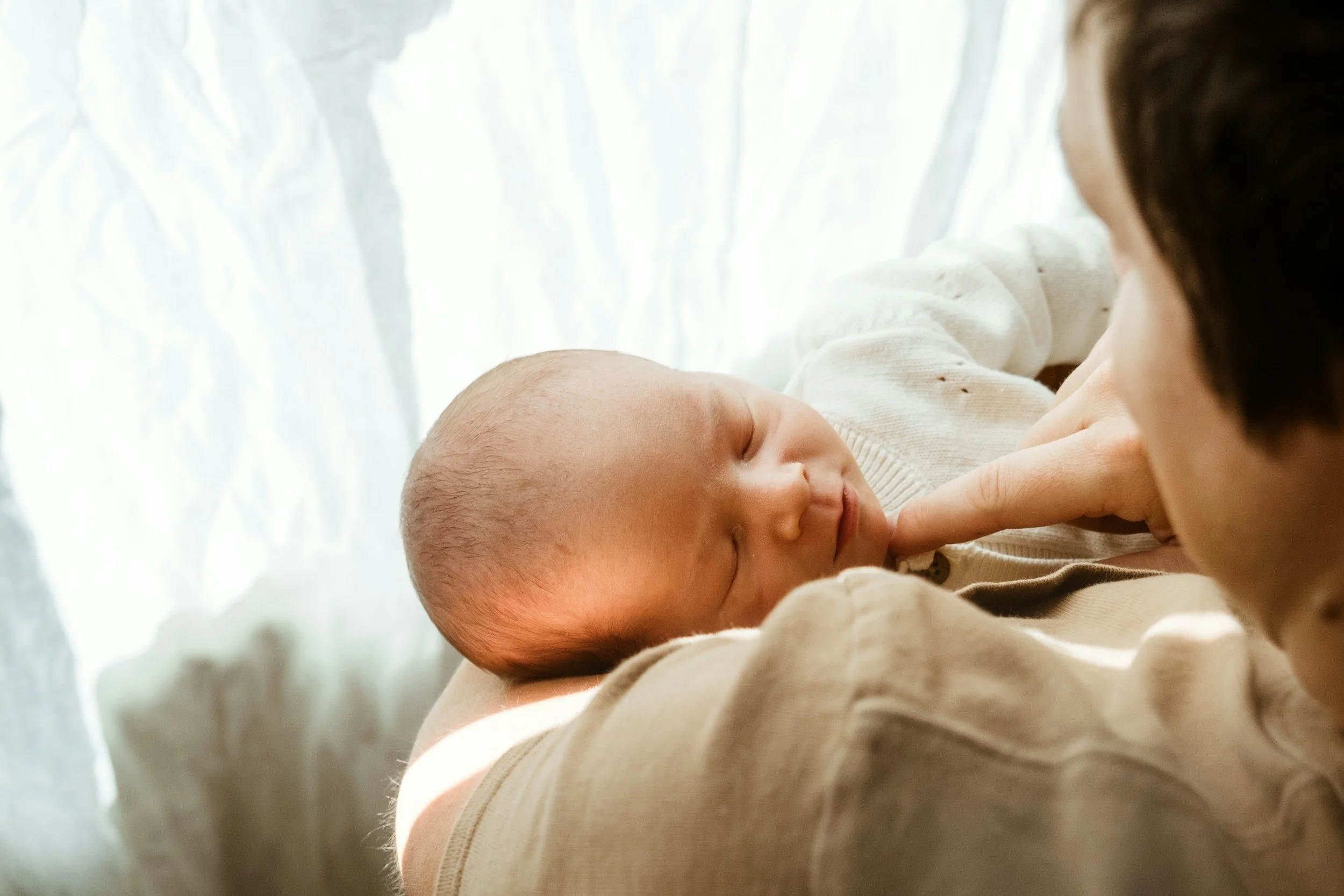New mom resting at home after working through breastfeeding guilt in Temecula
