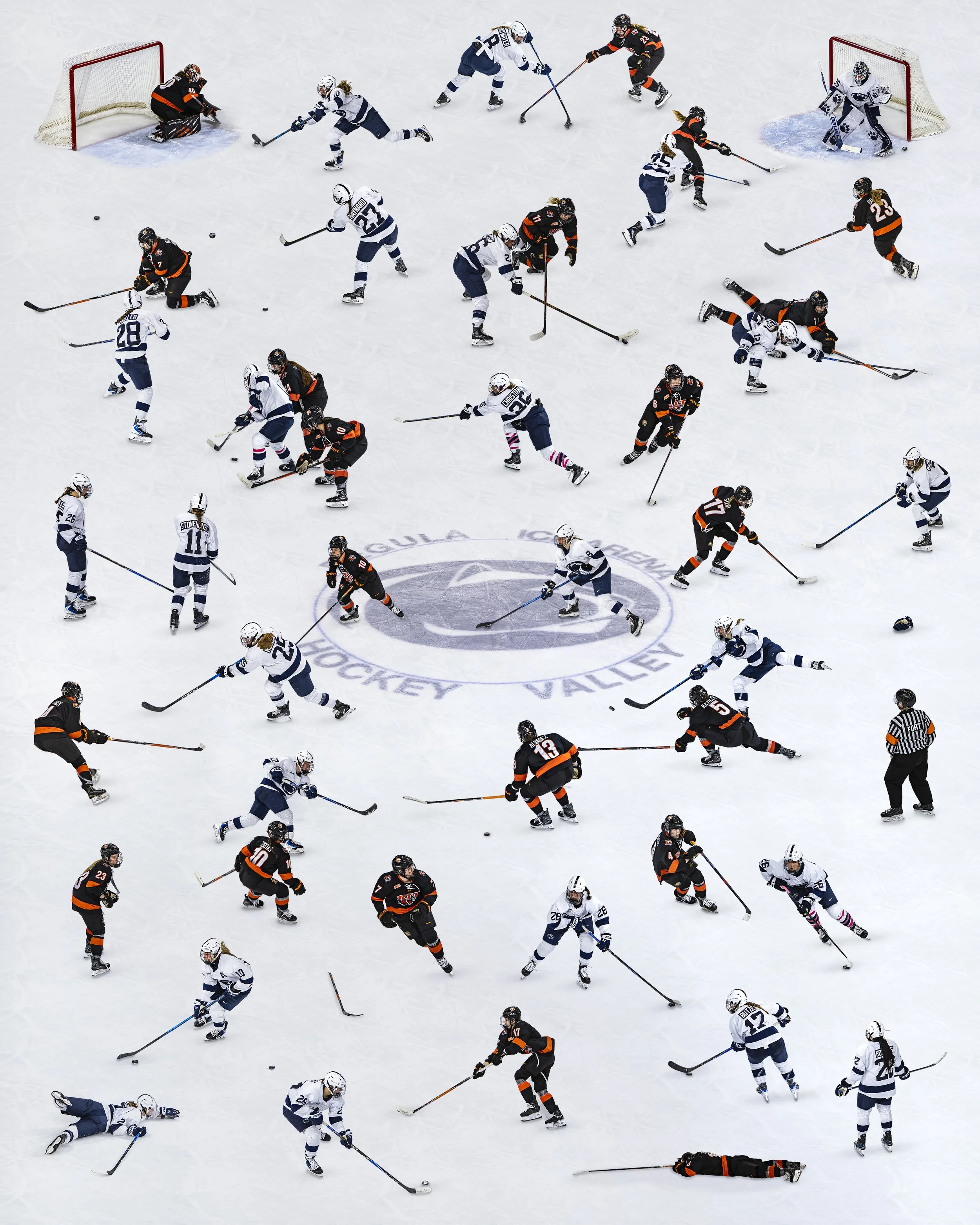 An ice hockey game with players from two teams, one in white jerseys and the other in black jerseys, competing for the puck near the goal area.