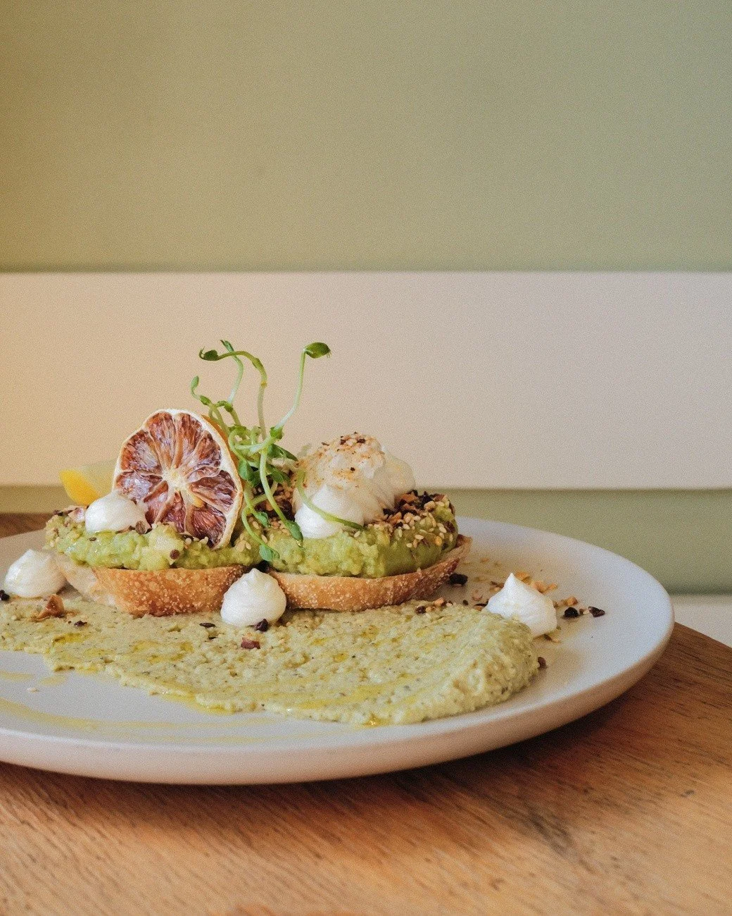Is it too soon to reuse "avo-lutely smashing!?"

No. Never.

Our newest version of the iconic smashed avo:

w/ poached eggs, whipped feta &amp; hazelnut cacao dukkah on fried sourdough w/ split pea &amp; mint hommus, lemon &amp; @wollundryg