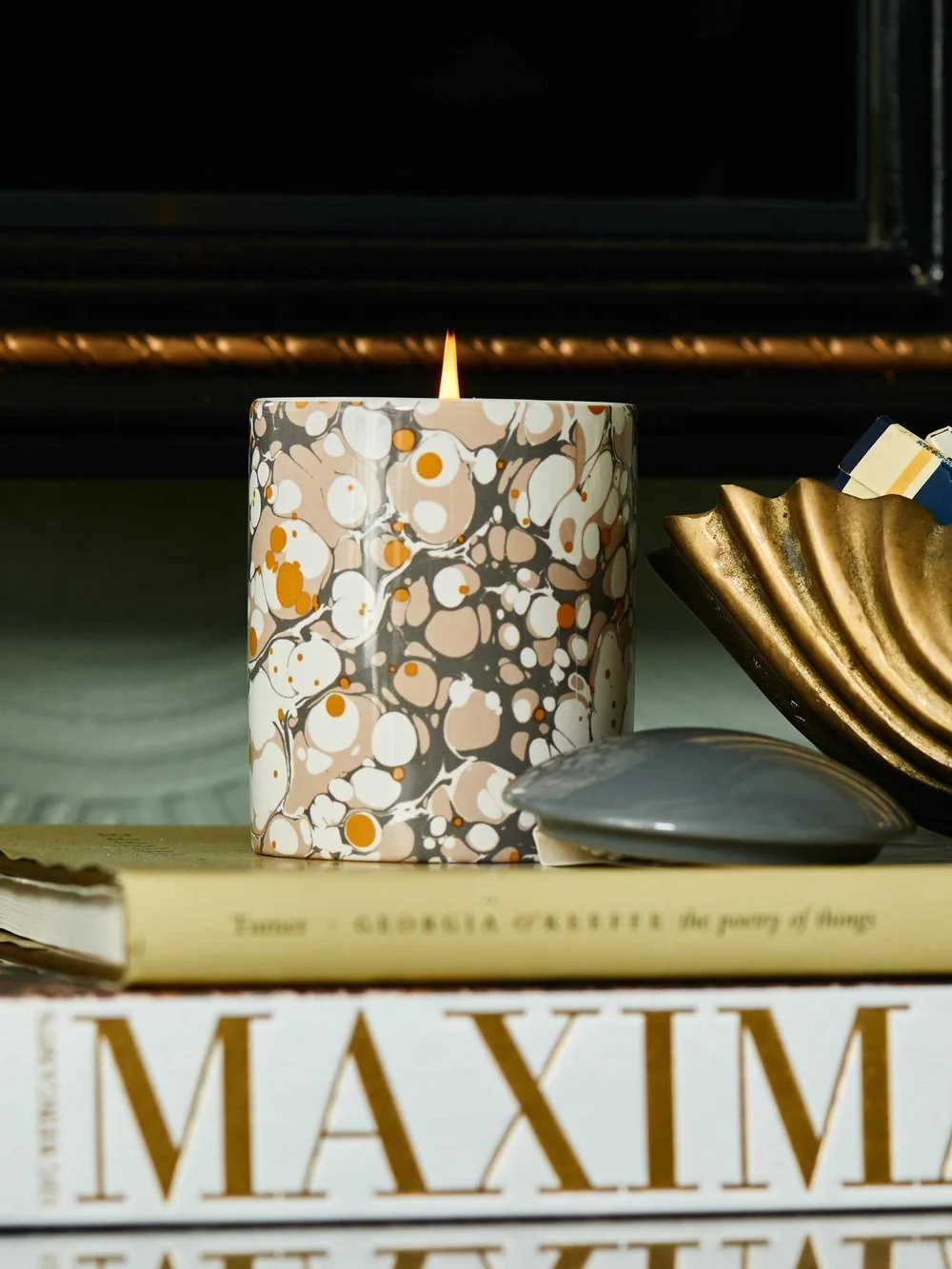 L'or de Seraphine brand photography art directed by Letter A — ceramic candle on styled tabletop