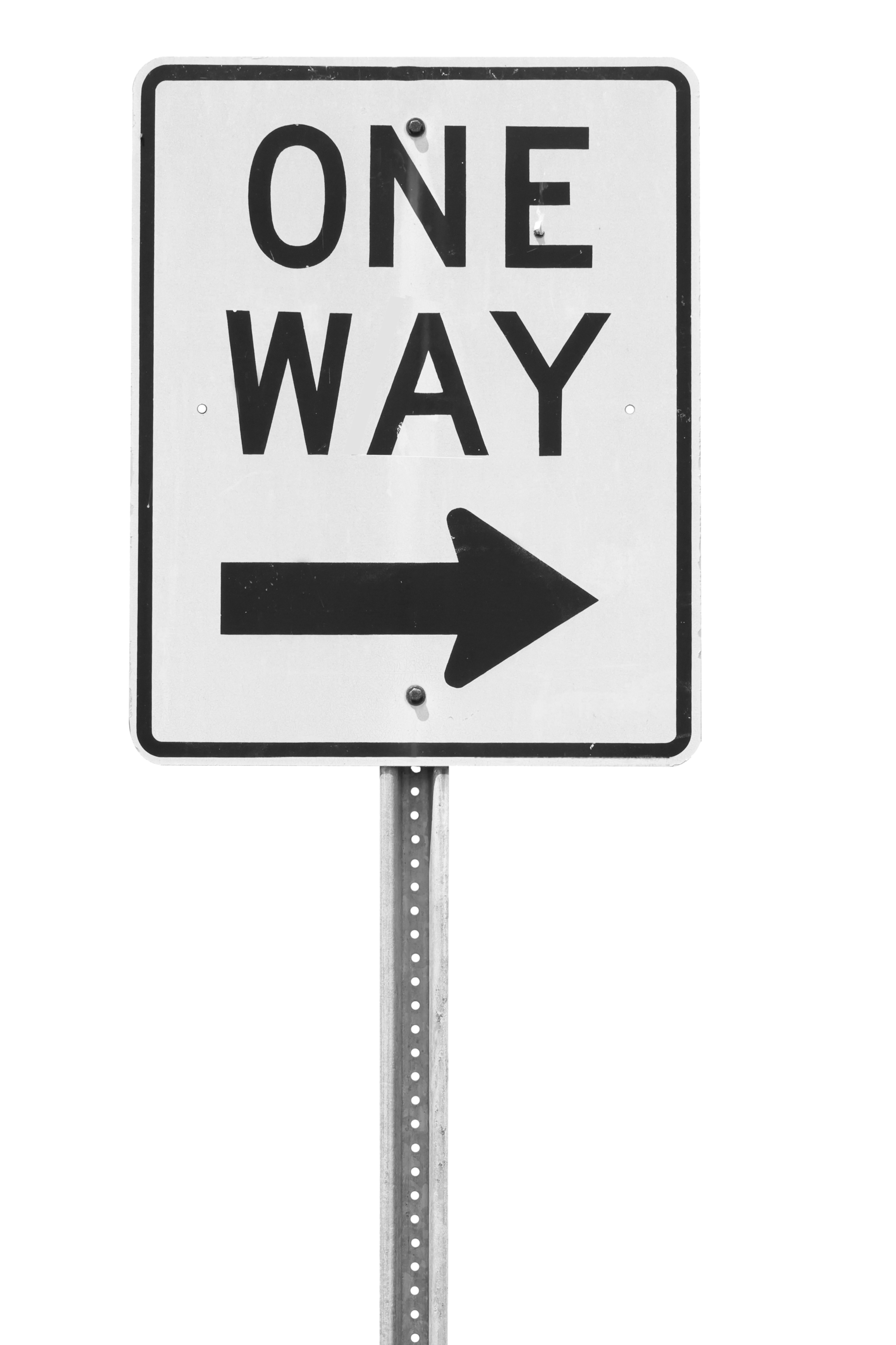 A black and white traffic sign indicating a one-way street with an arrow pointing to the right.