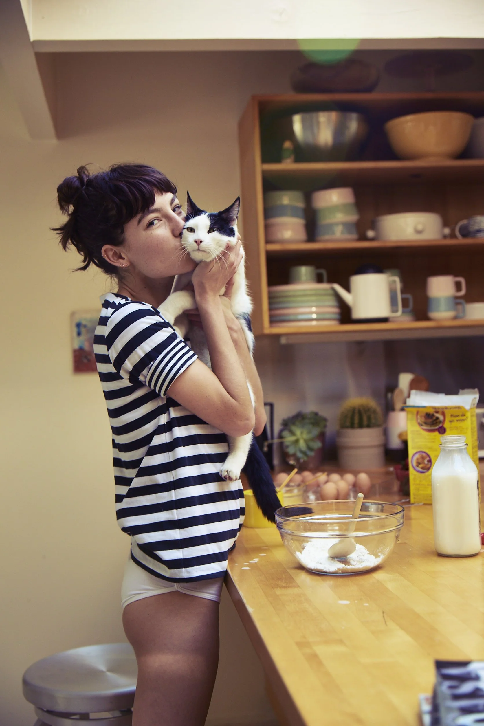 Girl cuddling cat for Kate Spade Saturday photo art direction by Allison Henry Aver