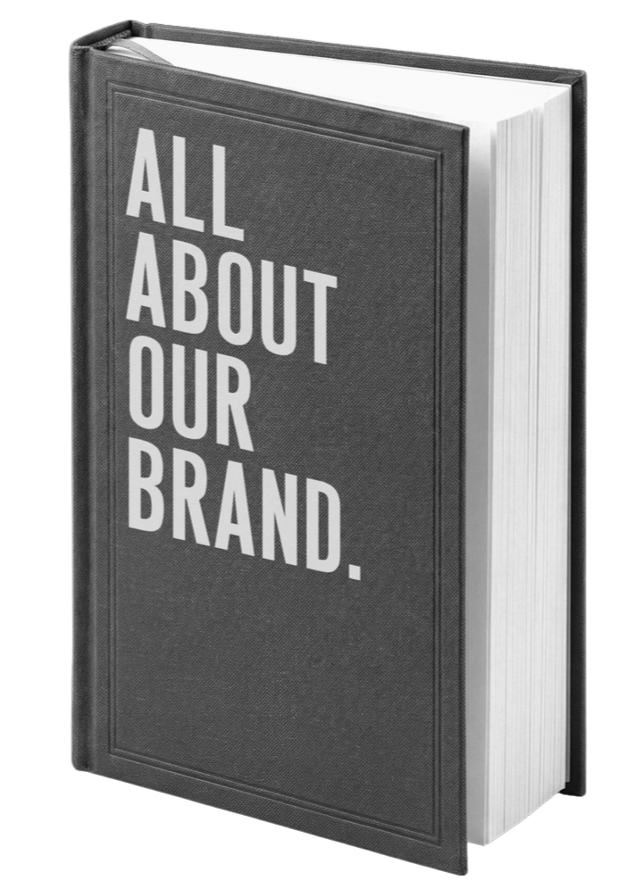 A book with a dark cover titled 'ALL ABOUT OUR BRAND' in large white letters.