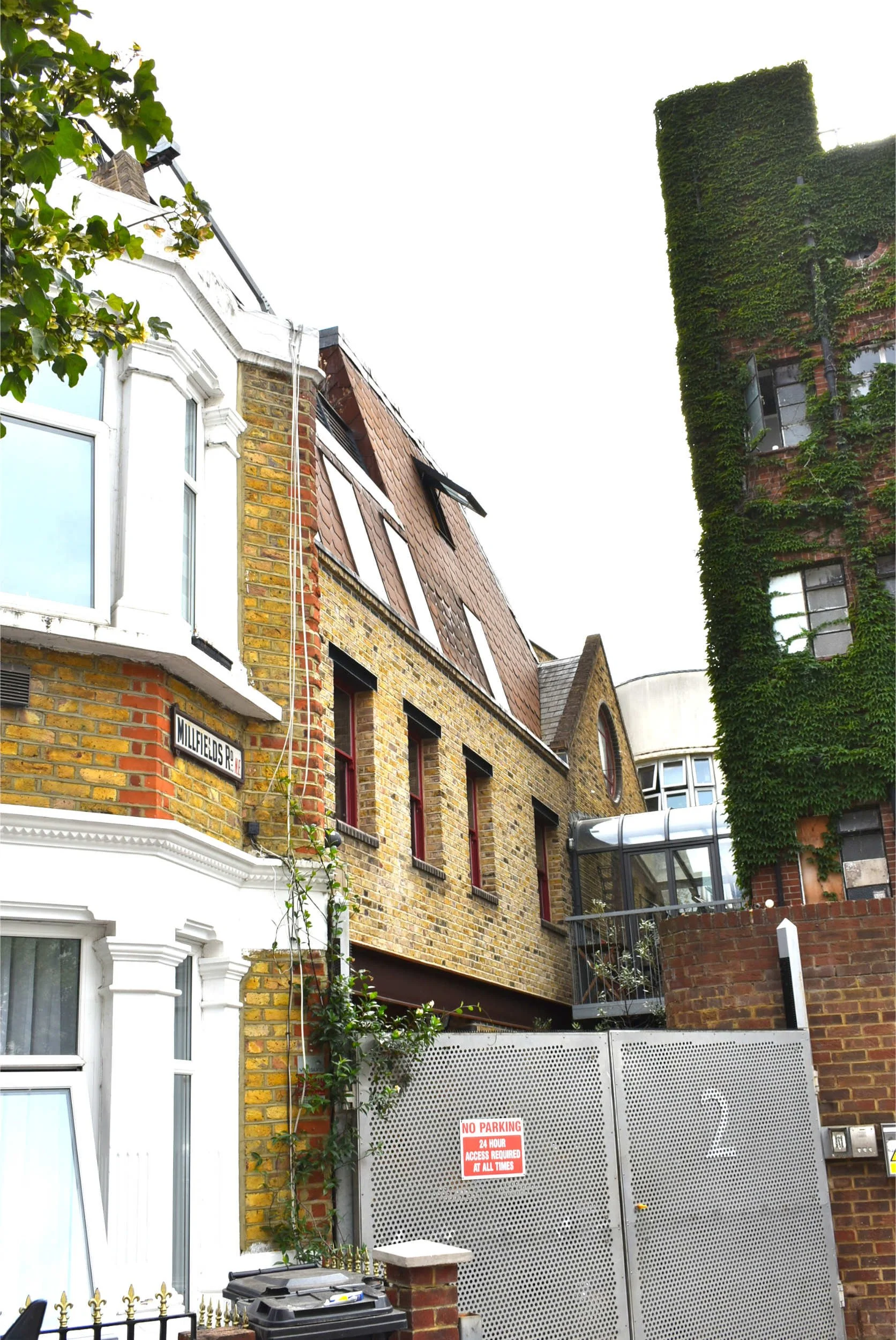 Infill site new house construction in the clapton pond conservation area showing the new house build next to an old victorian terrace