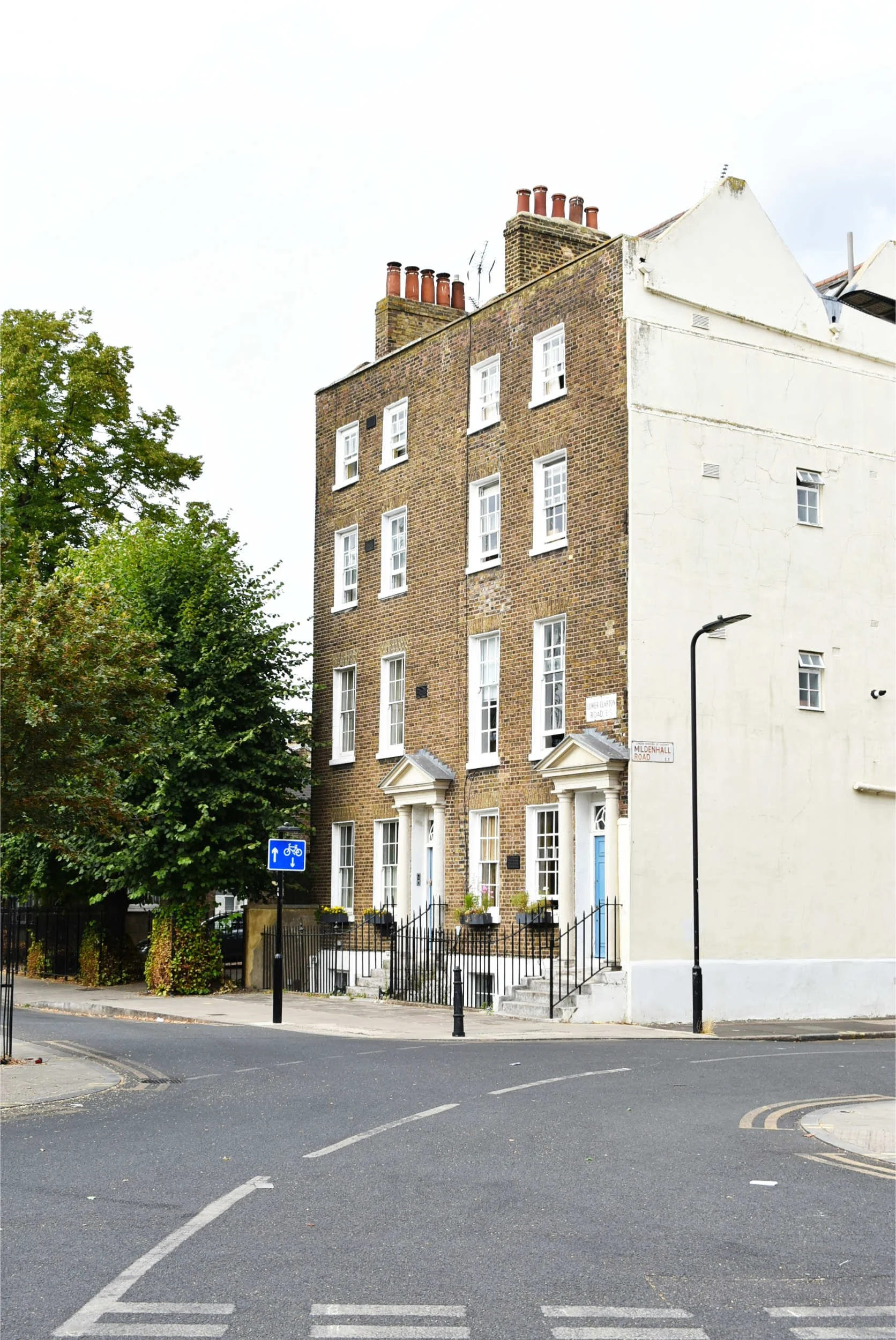 Photograph of the Clapton Pond Conservation Area with the prominent Georgian terrace on the corner of the road in Clapton Hackney