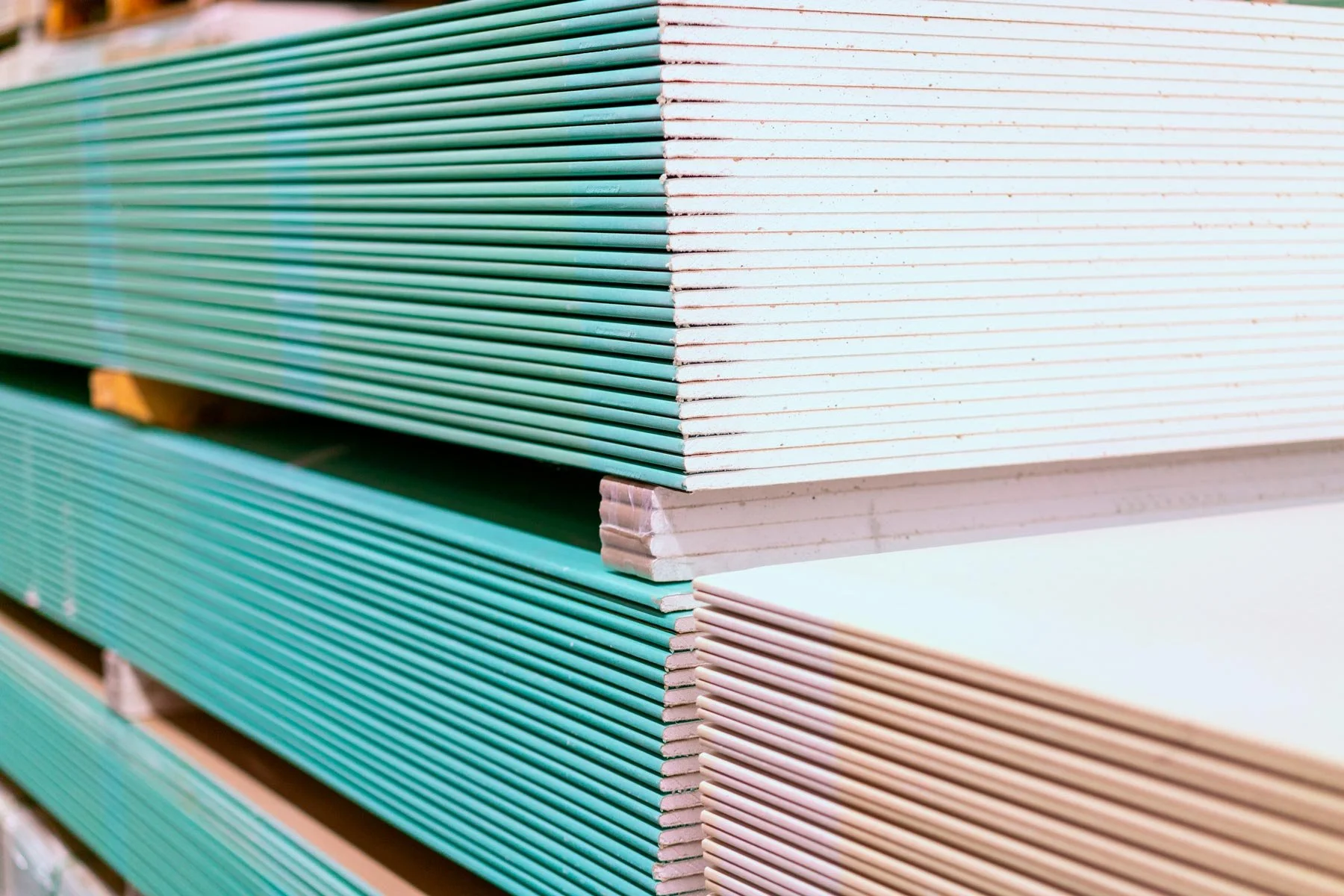 homeguide-pile-of-greenboard-drywall-sheets.jpg