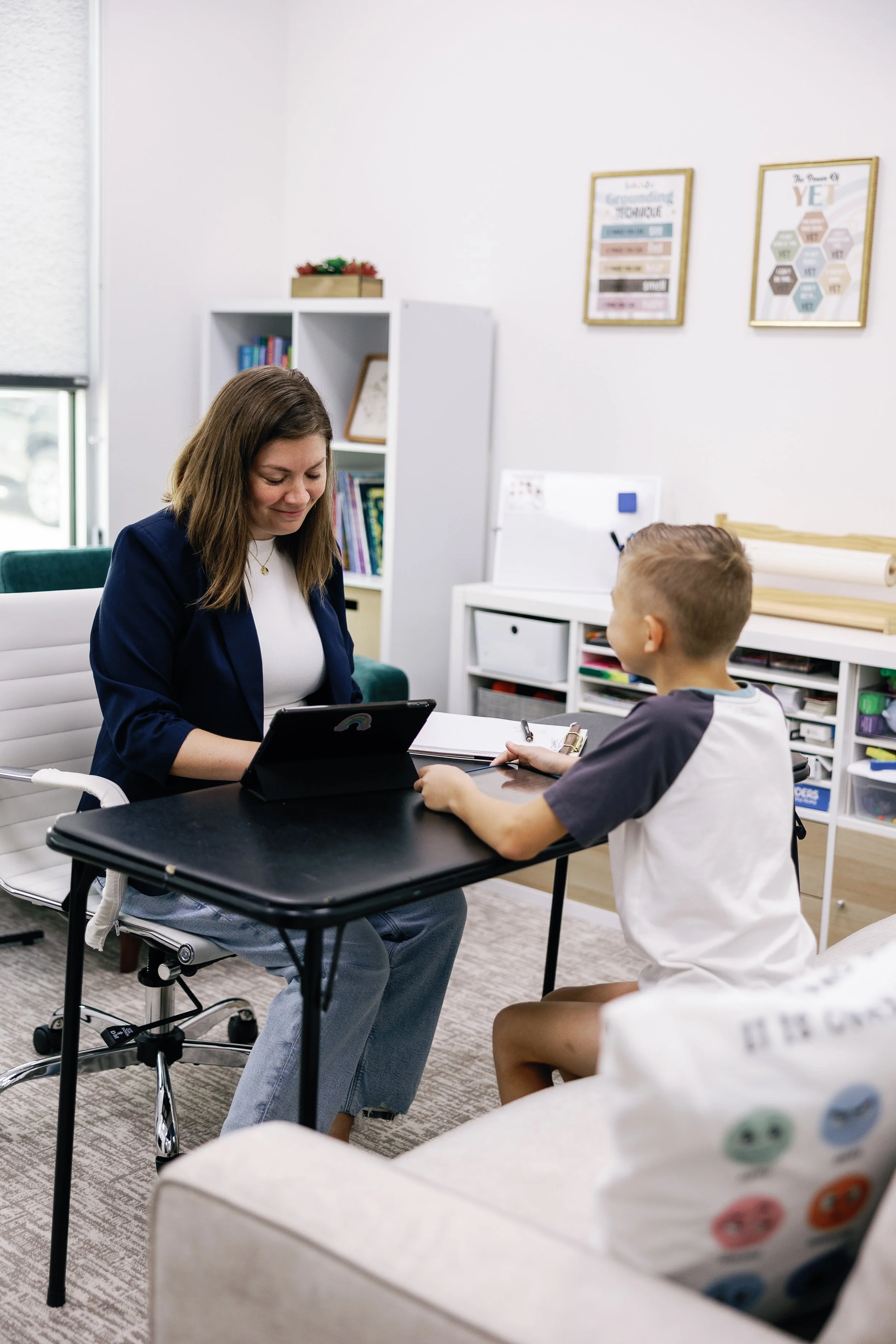 a child psychologist testing a child in her office Richmond, TX