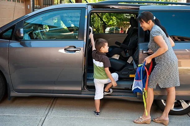 going to school, parenting, morning routine, mom and son getting in car