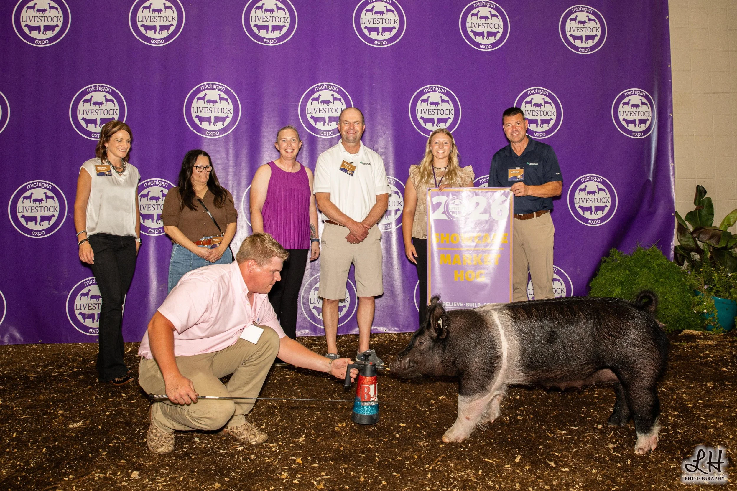 Saleabration backdrop photo with Joscelyn Layman, buyers and Showcase Market Hog 2026