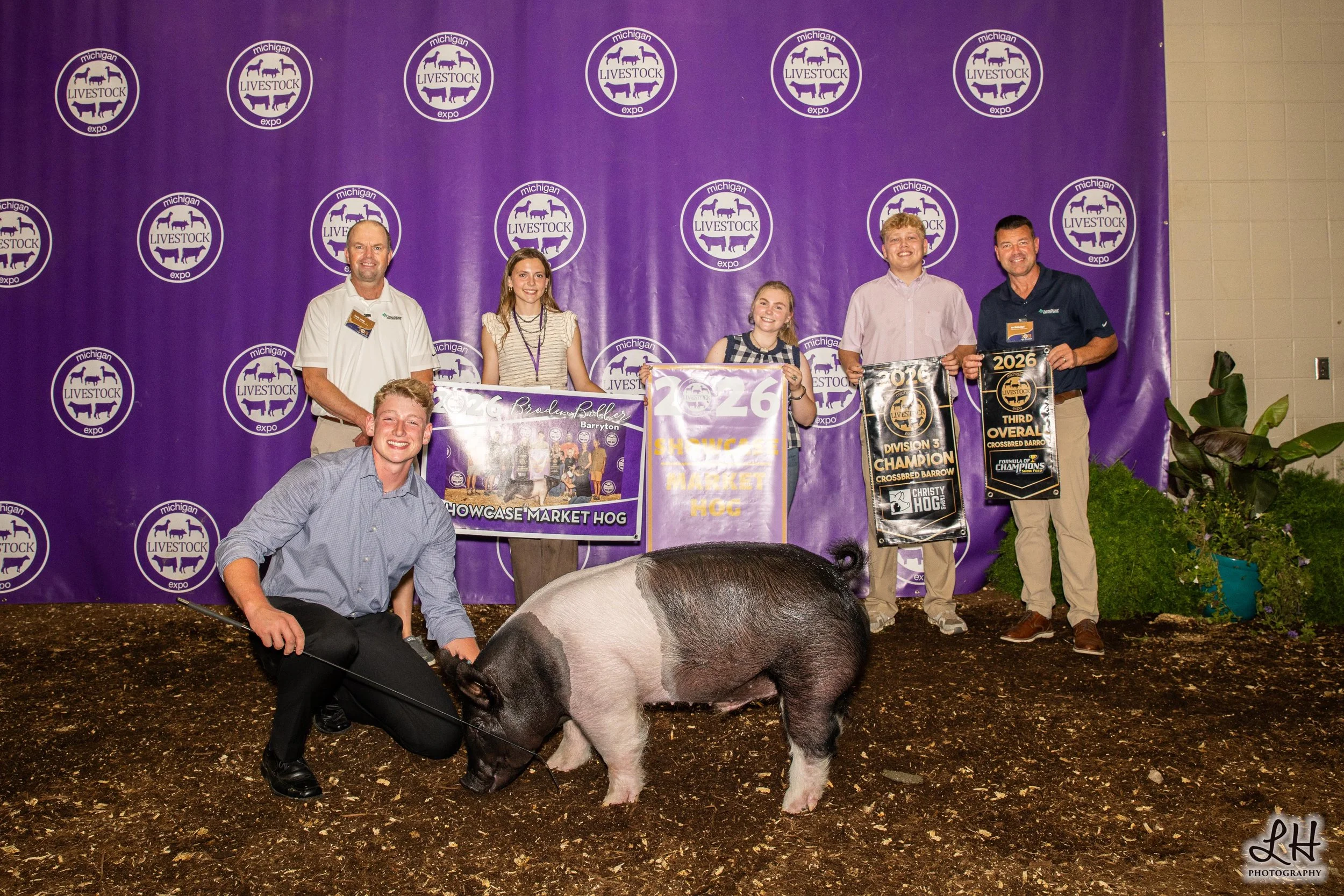 Saleabration backdrop photo with Broden Biller, Buyers and Showcase Market Hog 2026